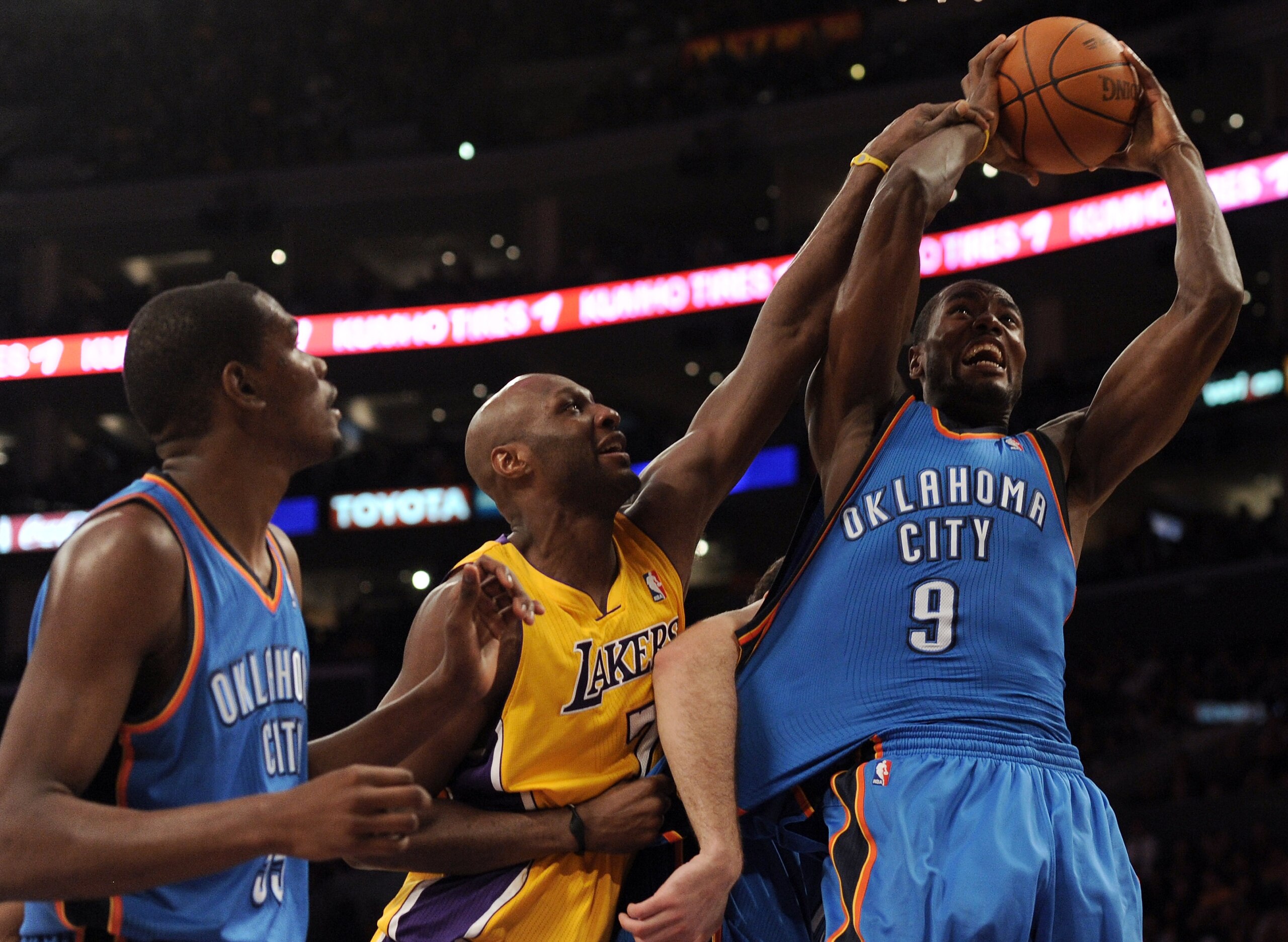 LOS ANGELES, CA - JANUARY 17:  Lamar Odom #7 of the Los Angeles Lakers is called for a foul on Serge Ibaka #9 of the Oklahoma City Thunder as Kevin Durant looks on during a 101-94 Laker win at the Staples Center on January 17, 2011 in Los Angeles, Califor
