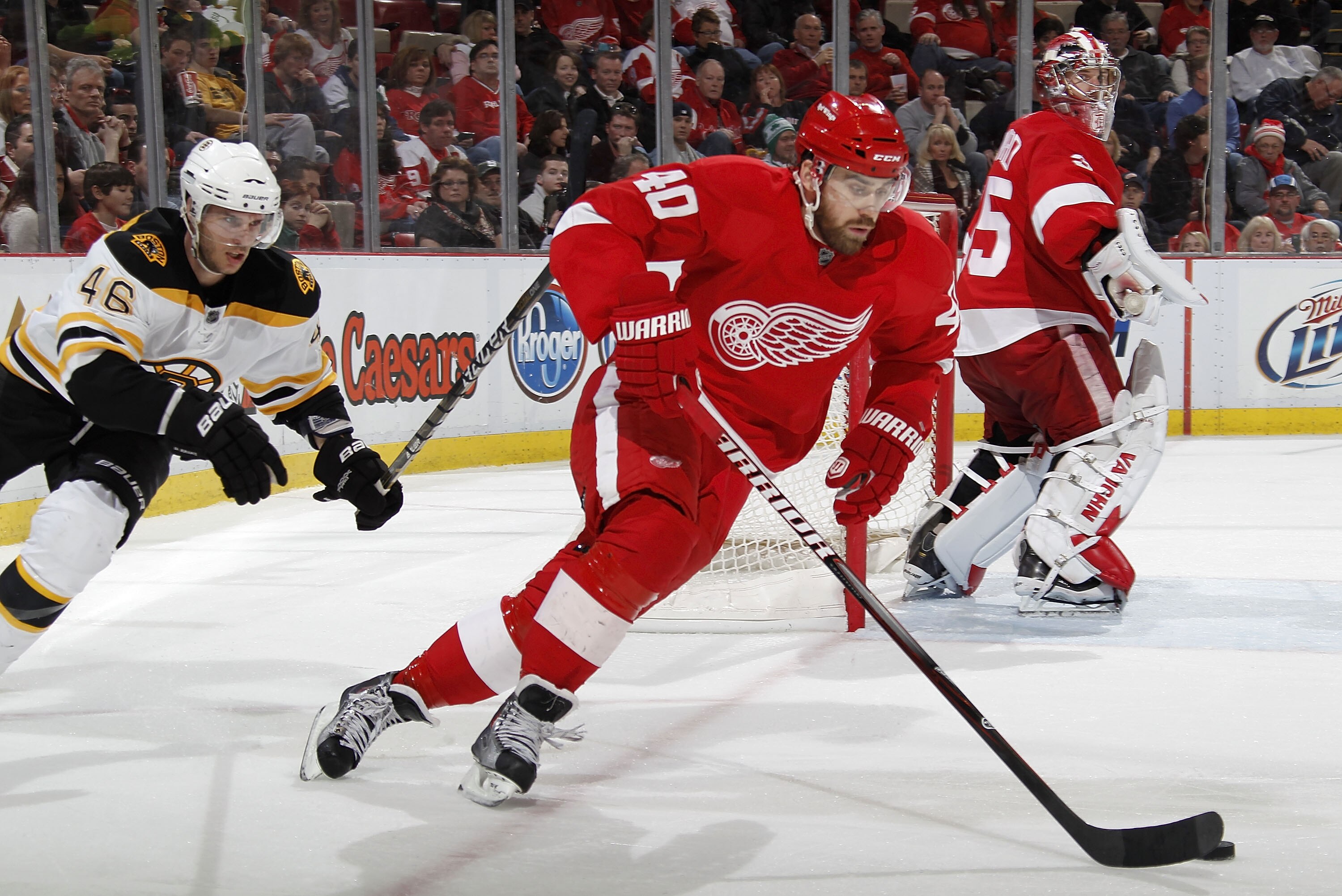 DETROIT, MI - FEBRUARY 13:  Henrik Zetterberg #40 of the Detroit Red Wings heads up ice in front of David Krejci #46 of the Boston Bruins with on February 13, 2011 at Joe Lewis Arena in Detroit, Michigan. Detroit won the game 4-2.  (Photo by Gregory Shamu