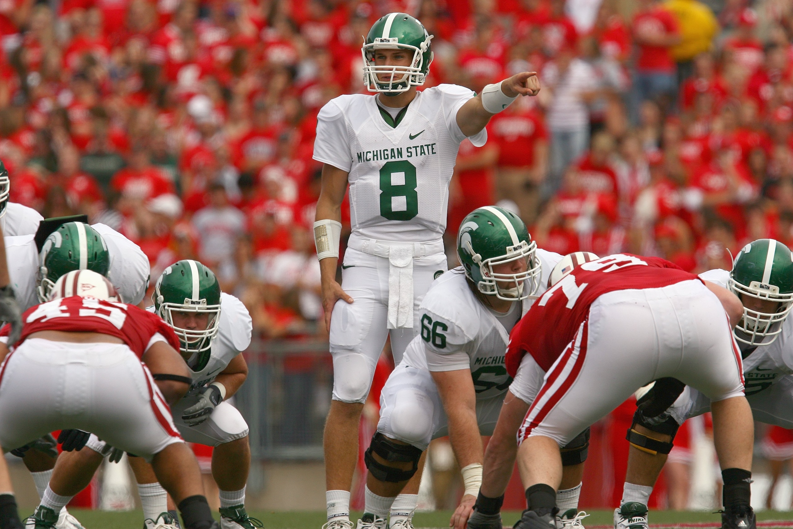 MADISON, WI - SEPTEMBER 26: Kirk Cousins #8 of the Michigan State Spartans motions on the line against the Wisconsin Badgers on September 26, 2009 at Camp Randall Stadium in Madison, Wisconsin. (Photo by Jonathan Daniel/Getty Images)