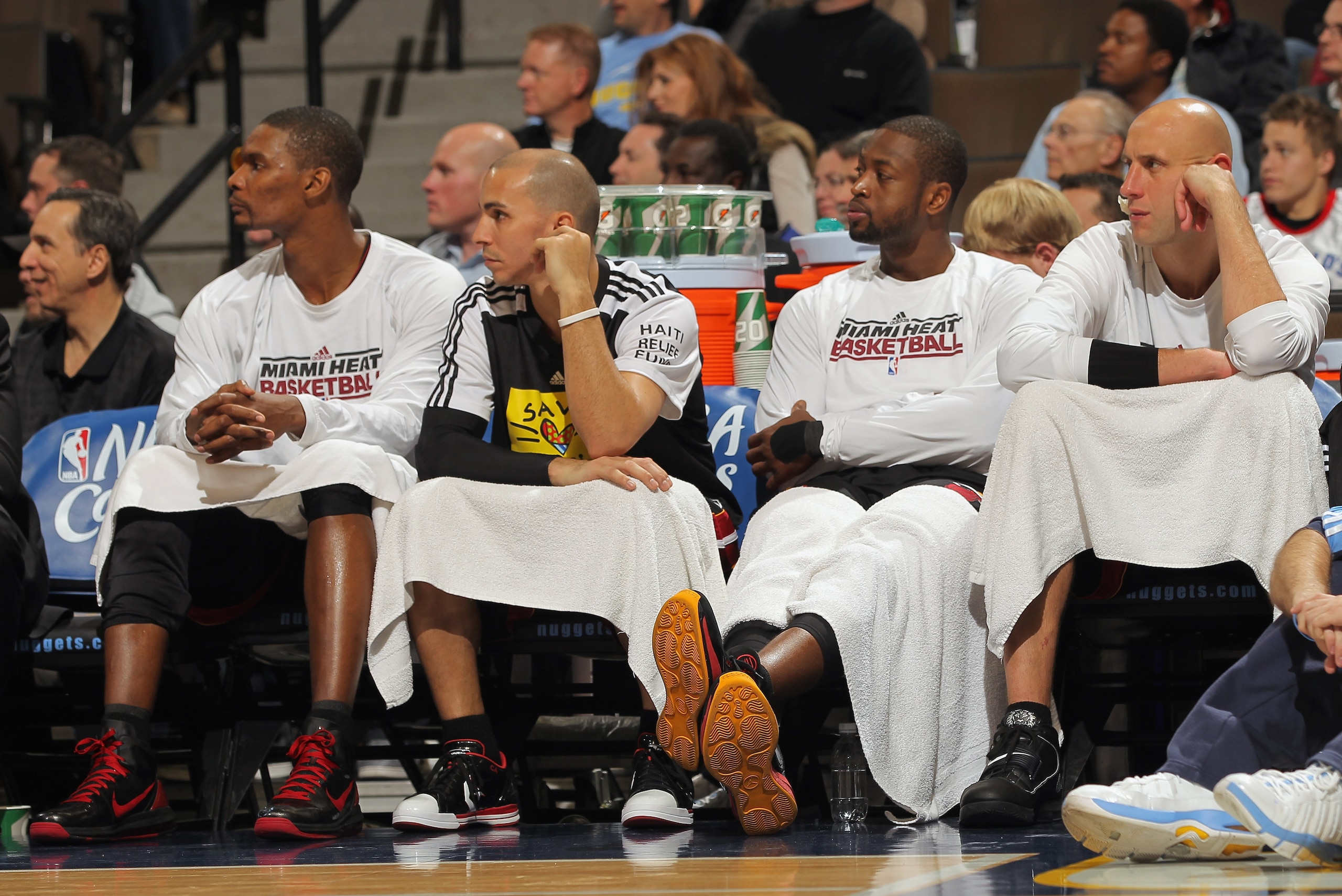 DENVER, CO - JANUARY 13: (L-R) Chris Bosh #1, Carlos Arroyo #8, Dwayne Wade #3 and Zydrunas Ilgaukas #11 of the Miami Heat sit on the bench in the fourth quarter against the Denver Nuggets at the Pepsi Center on January 13, 2011 in Denver, Colorado. The DENVER, CO - JANUARY 13: (L-R) Chris Bosh #1, Carlos Arroyo #8, Dwayne Wade #3 and Zydrunas Ilgaukas #11 of the Miami Heat sit on the bench in the fourth quarter against the Denver Nuggets at the Pepsi Center on January 13, 2011 in Denver, Colorado. The
