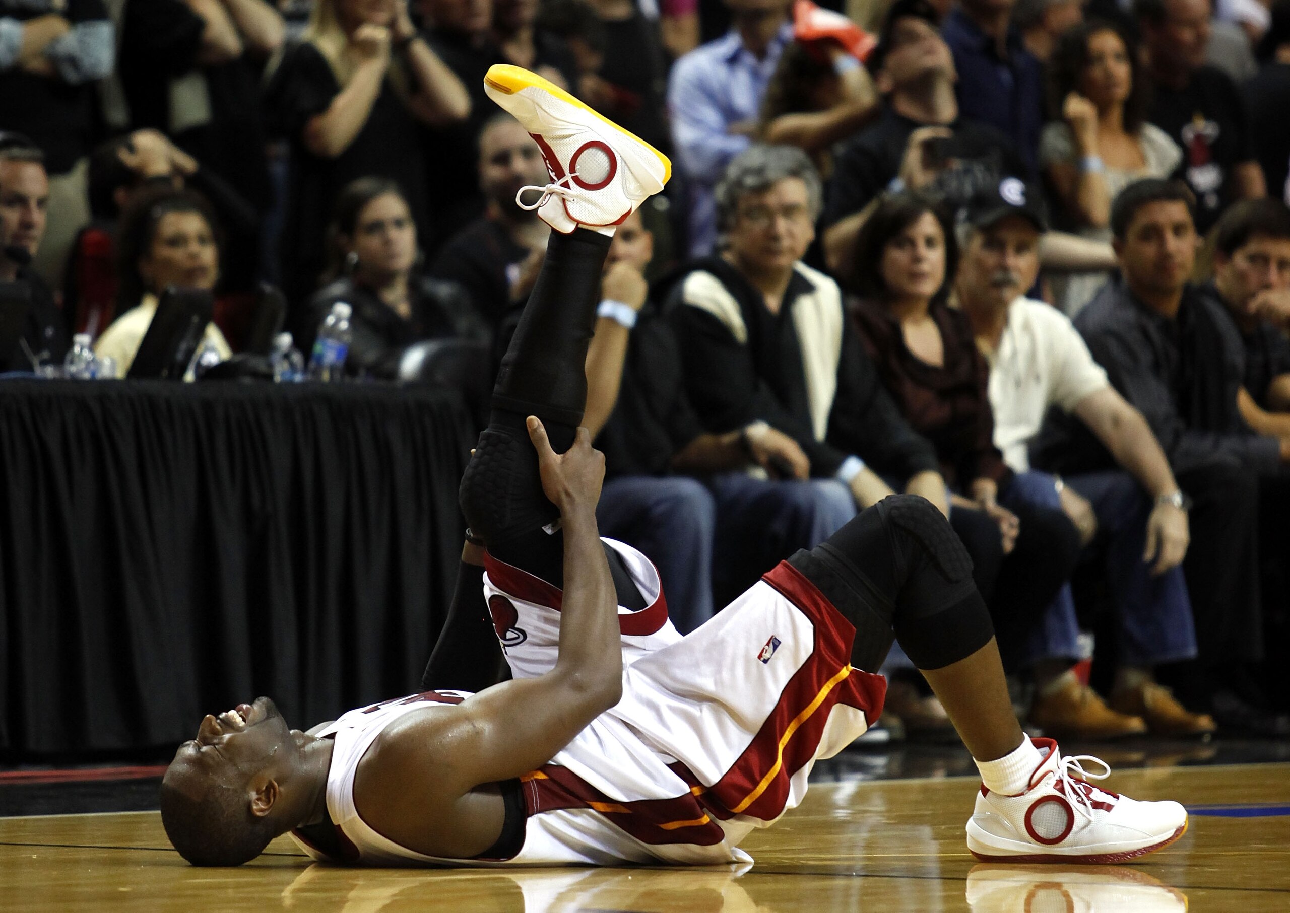 MIAMI - APRIL 23: Guard Dwyane Wade #3 of the Miami Heat stays on the fl;oor injured during a 100-98 loss to the Boston Celtics in Game Three of the Eastern Conference Quarterfinals during the 2010 NBA Playoffs at American Airlines Arena on April 23, 201 MIAMI - APRIL 23: Guard Dwyane Wade #3 of the Miami Heat stays on the fl;oor injured during a 100-98 loss to the Boston Celtics in Game Three of the Eastern Conference Quarterfinals during the 2010 NBA Playoffs at American Airlines Arena on April 23, 201
