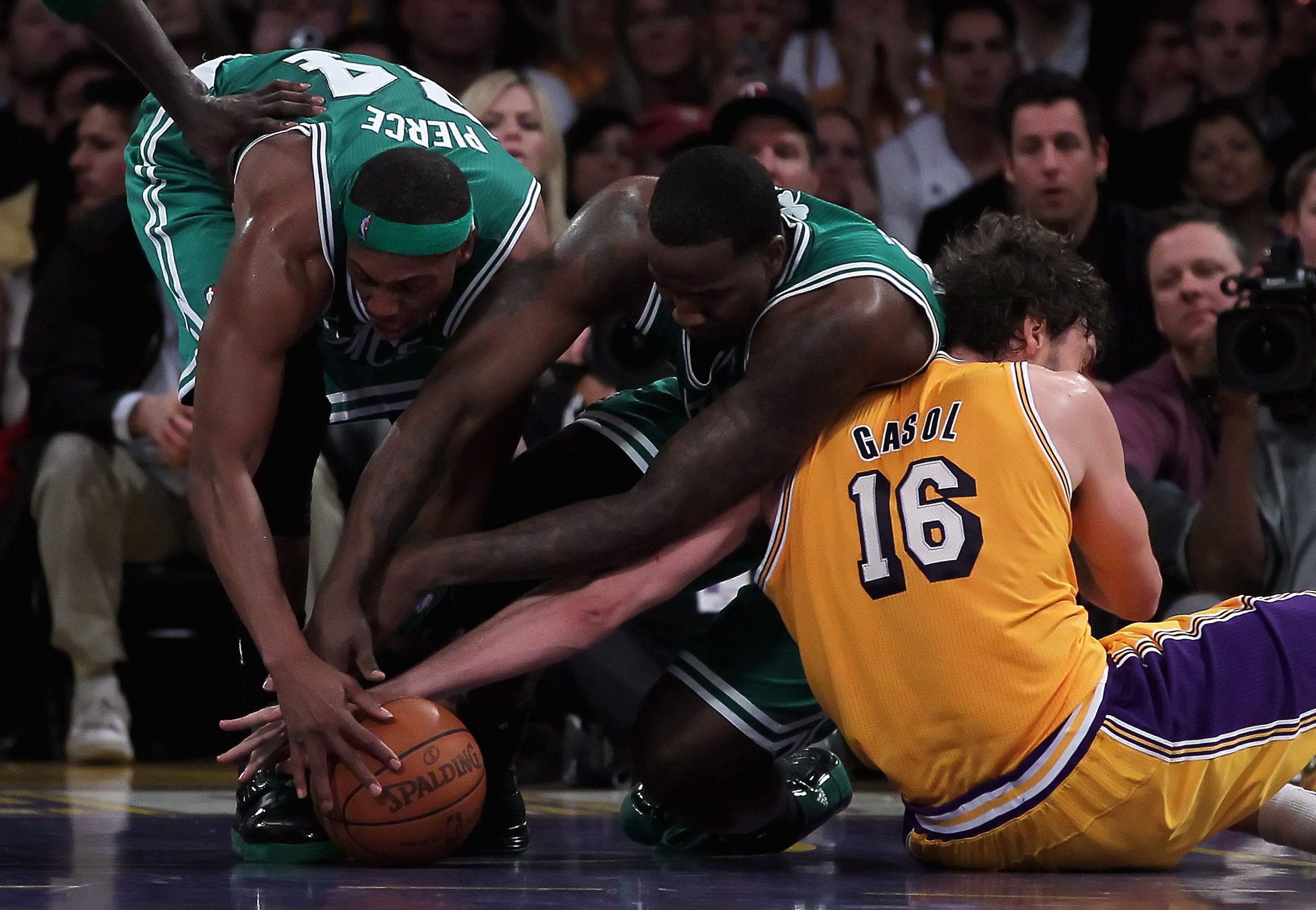 LOS ANGELES, CA - JANUARY 30: (L-R) Paul Pierce #34 and Kendrick Perkins #43 of the Boston Celtics fight for a loose ball with Pau Gasol #16 of the Los Angeles Lakers in the second half at Staples Center on January 30, 2011 in Los Angeles, California. Th LOS ANGELES, CA - JANUARY 30: (L-R) Paul Pierce #34 and Kendrick Perkins #43 of the Boston Celtics fight for a loose ball with Pau Gasol #16 of the Los Angeles Lakers in the second half at Staples Center on January 30, 2011 in Los Angeles, California. Th