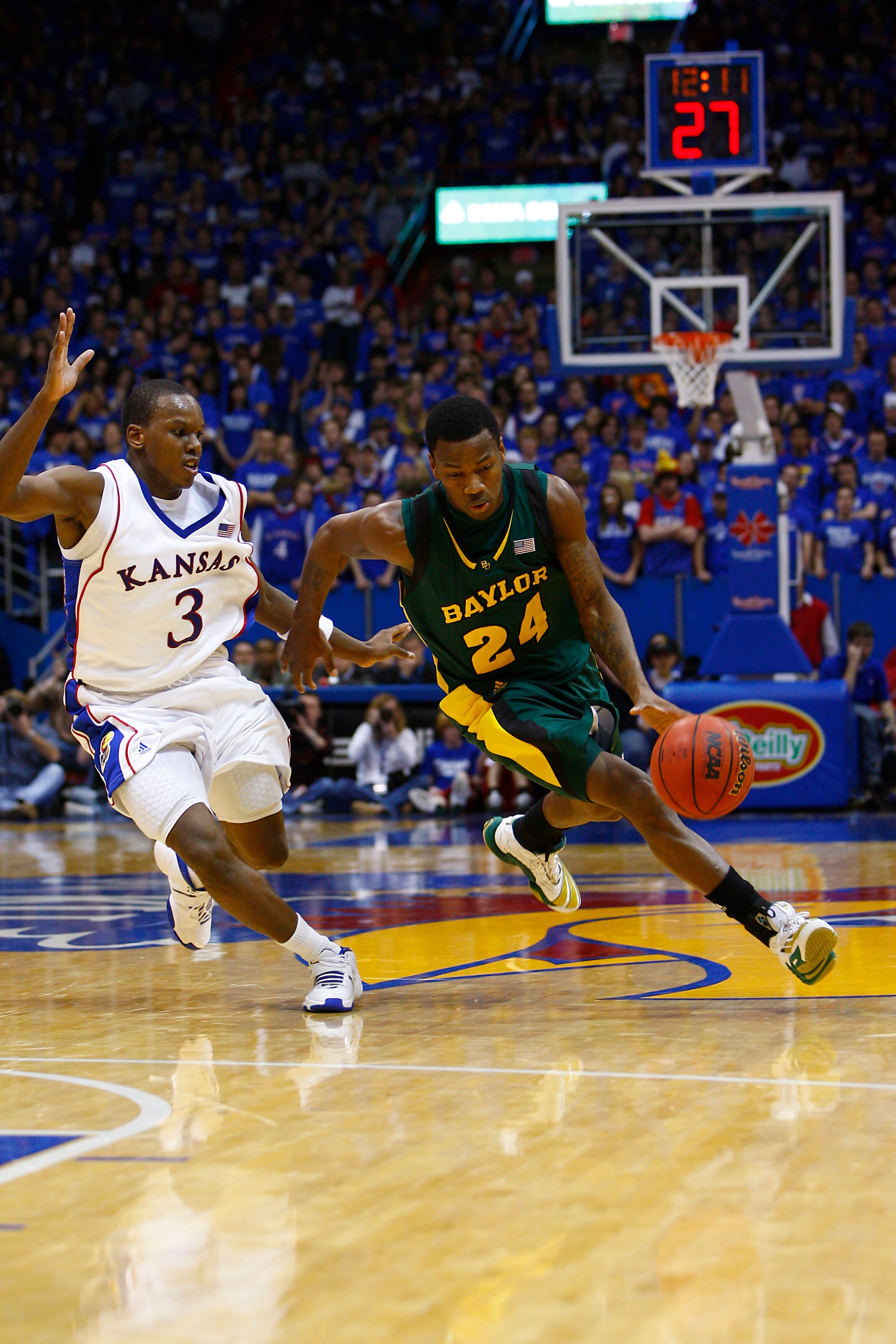 LAWRENCE, KS - FEBRUARY 9:  LaceDarius Dunn #24 of the Baylor Bears drives the ball against Russell Robinson #3 of the Kansas Jayhawks on February 9, 2008 at Allen Fieldhouse in Lawrence, Kansas.  Kansas defeated Baylor 100-90. (Photo by G. Newman Lowranc