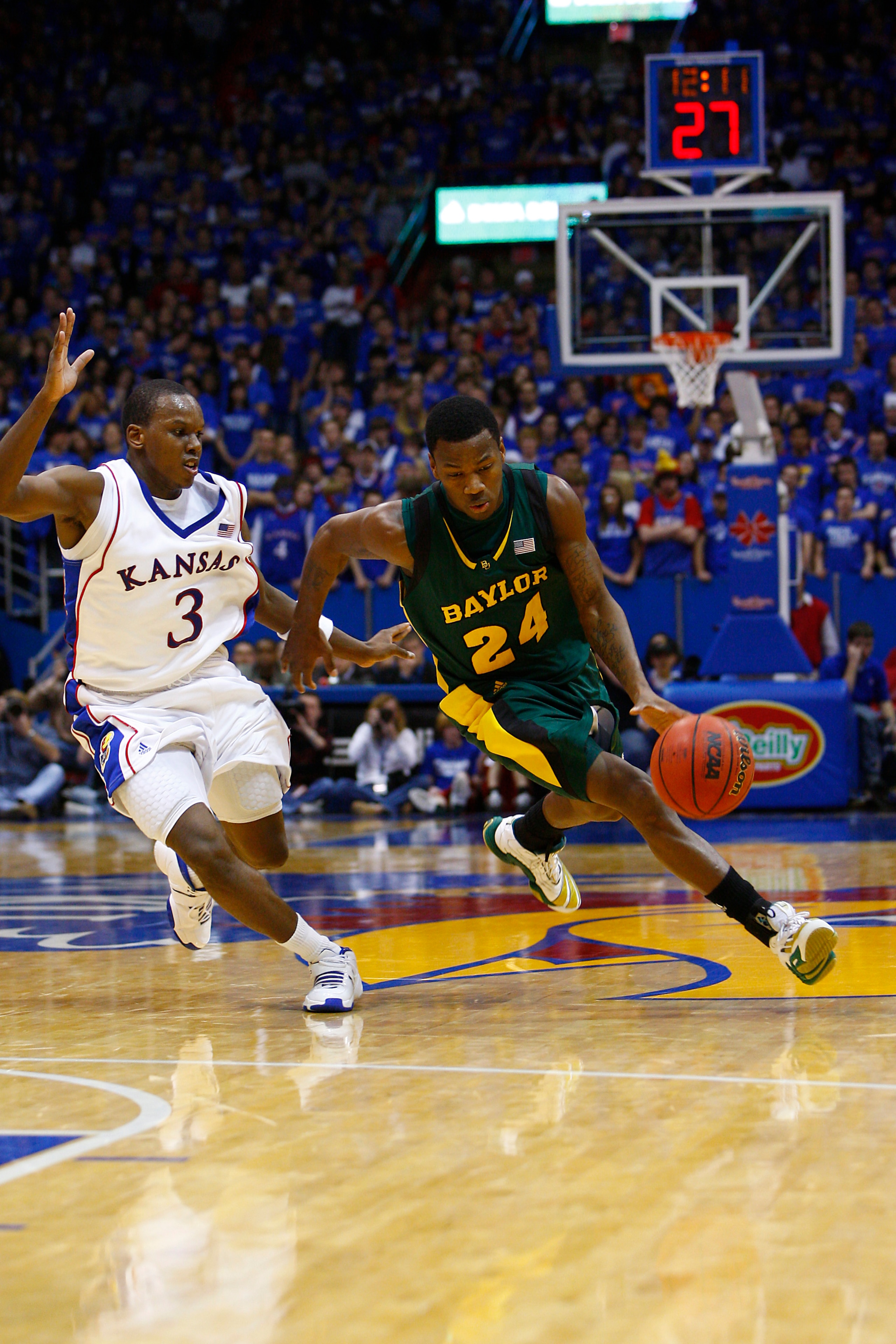 LAWRENCE, KS - FEBRUARY 9:  LaceDarius Dunn #24 of the Baylor Bears drives the ball against Russell Robinson #3 of the Kansas Jayhawks on February 9, 2008 at Allen Fieldhouse in Lawrence, Kansas.  Kansas defeated Baylor 100-90. (Photo by G. Newman Lowranc