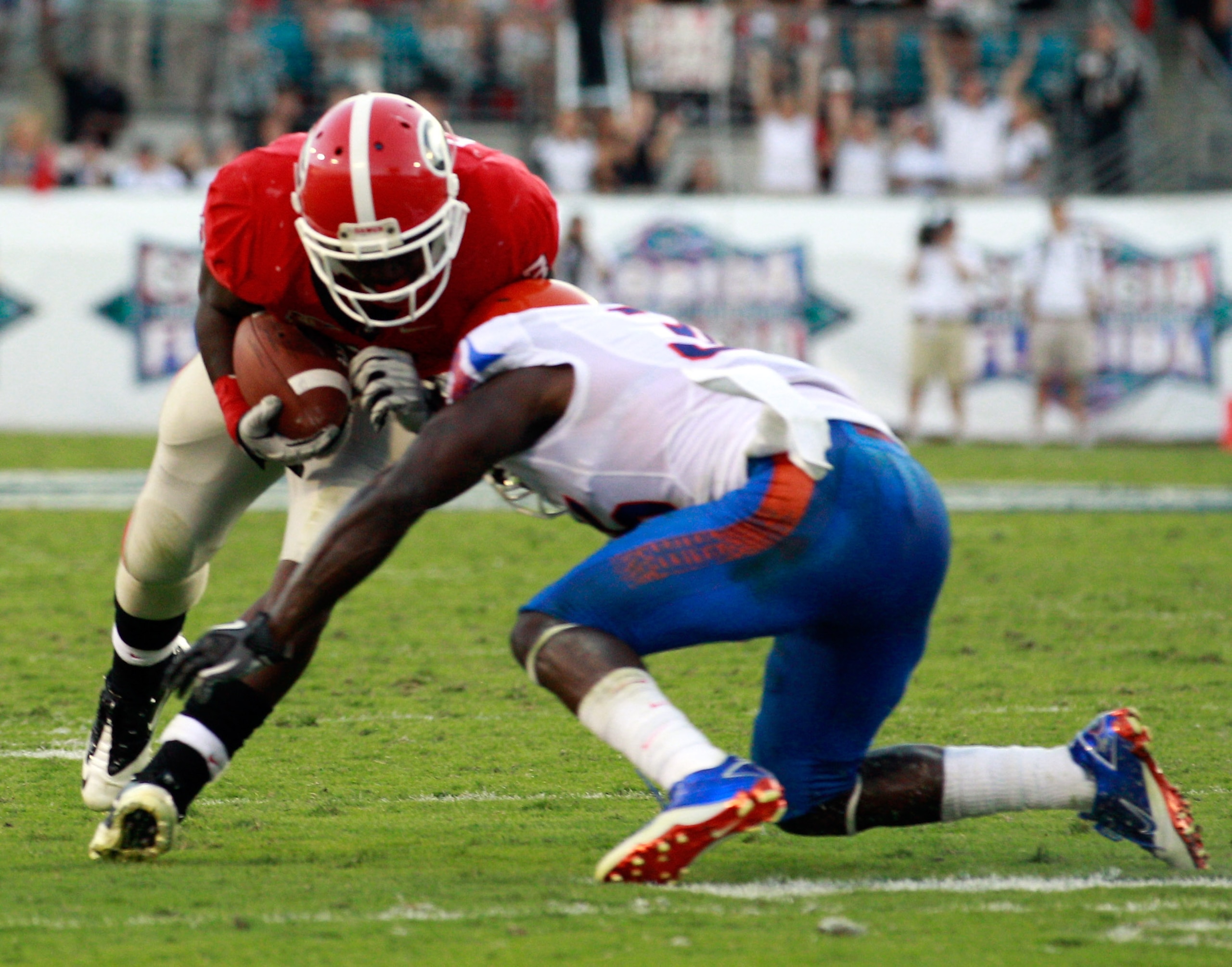 JACKSONVILLE, FL - OCTOBER 30:  Washaun Ealey #3 of the Georgia Bulldogs attempts to run past Ahmad Black #35 of the Florida Gators during the game at EverBank Field on October 30, 2010 in Jacksonville, Florida.  (Photo by Sam Greenwood/Getty Images)