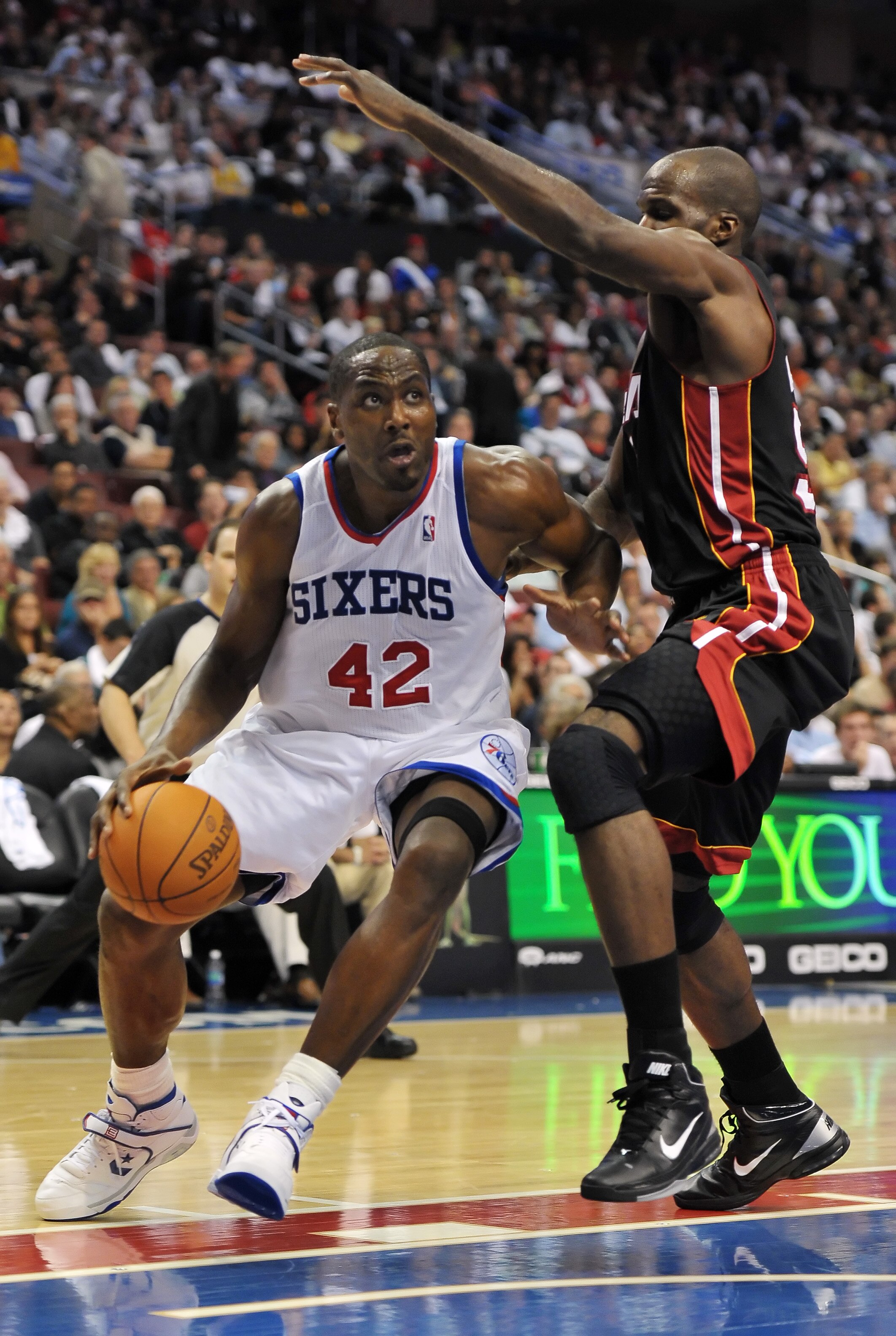 PHILADELPHIA - OCTOBER 27:  Elton Brand #42 of the Philadelphia 76ers drives to the net around Joel Anthony #50 of the Miami Heat at the Wells Fargo Center on October 27, 2010 in Philadelphia, Pennsylvania. NOTE TO USER: User expressly acknowledges and ag