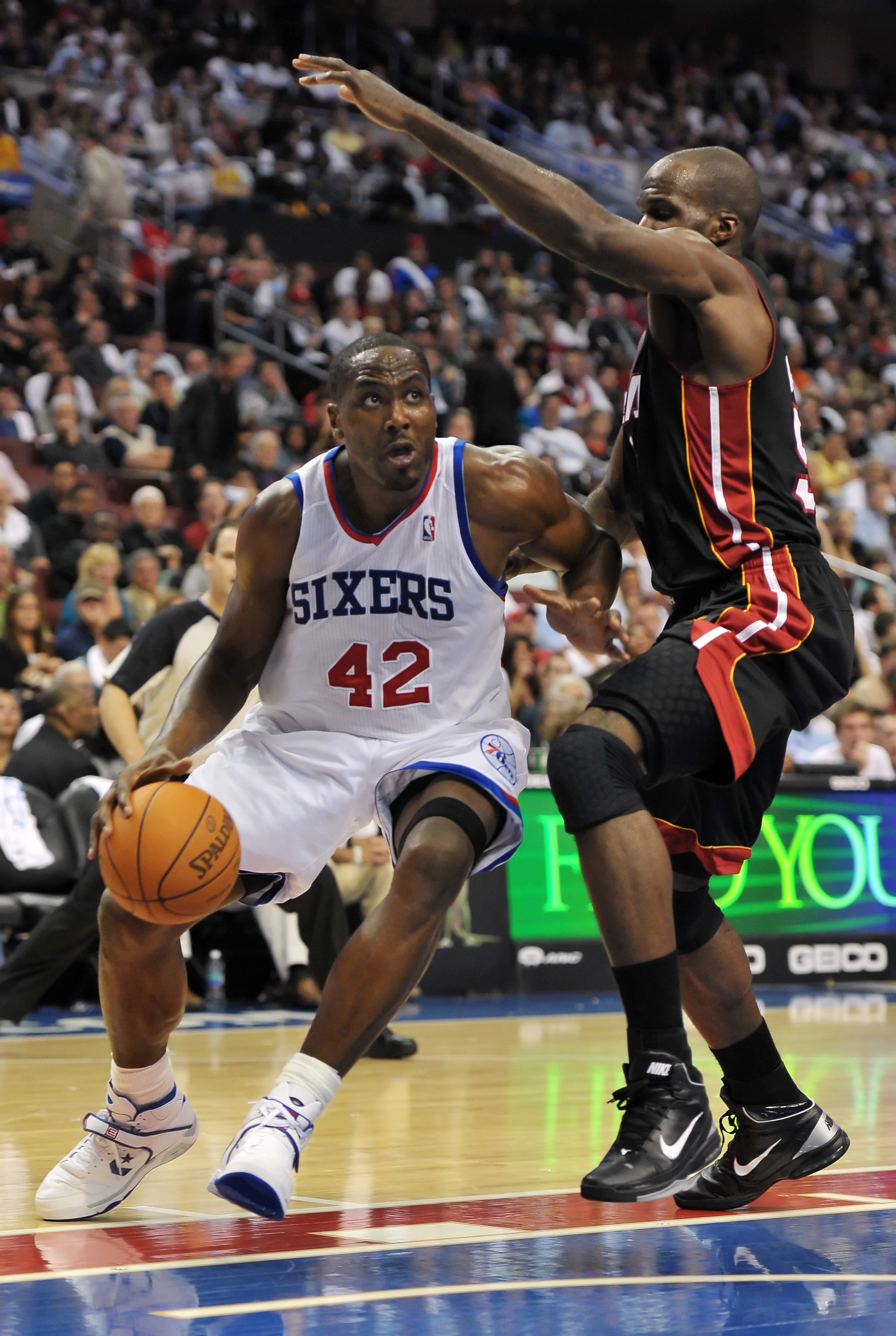 PHILADELPHIA - OCTOBER 27:  Elton Brand #42 of the Philadelphia 76ers drives to the net around Joel Anthony #50 of the Miami Heat at the Wells Fargo Center on October 27, 2010 in Philadelphia, Pennsylvania. NOTE TO USER: User expressly acknowledges and ag