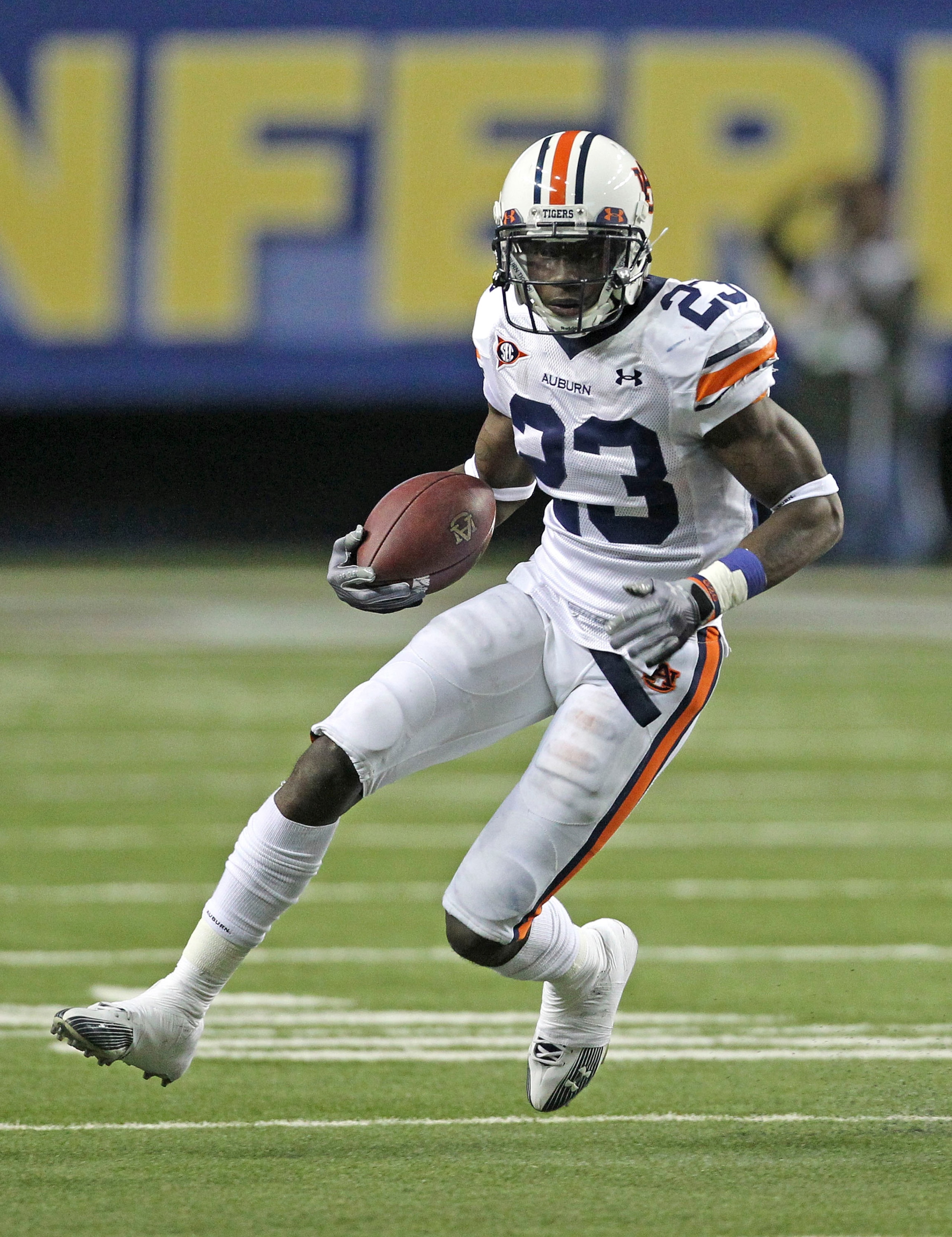 ATLANTA - DECEMBER 4:  Running back Onterio McCalebb #23 of the Auburn Tigers runs with the ball during the 2010 SEC Championship against the South Carolina Gamecocks at Georgia Dome on December 4, 2010 in Atlanta, Georgia.  The Tigers beat the Gamecocks