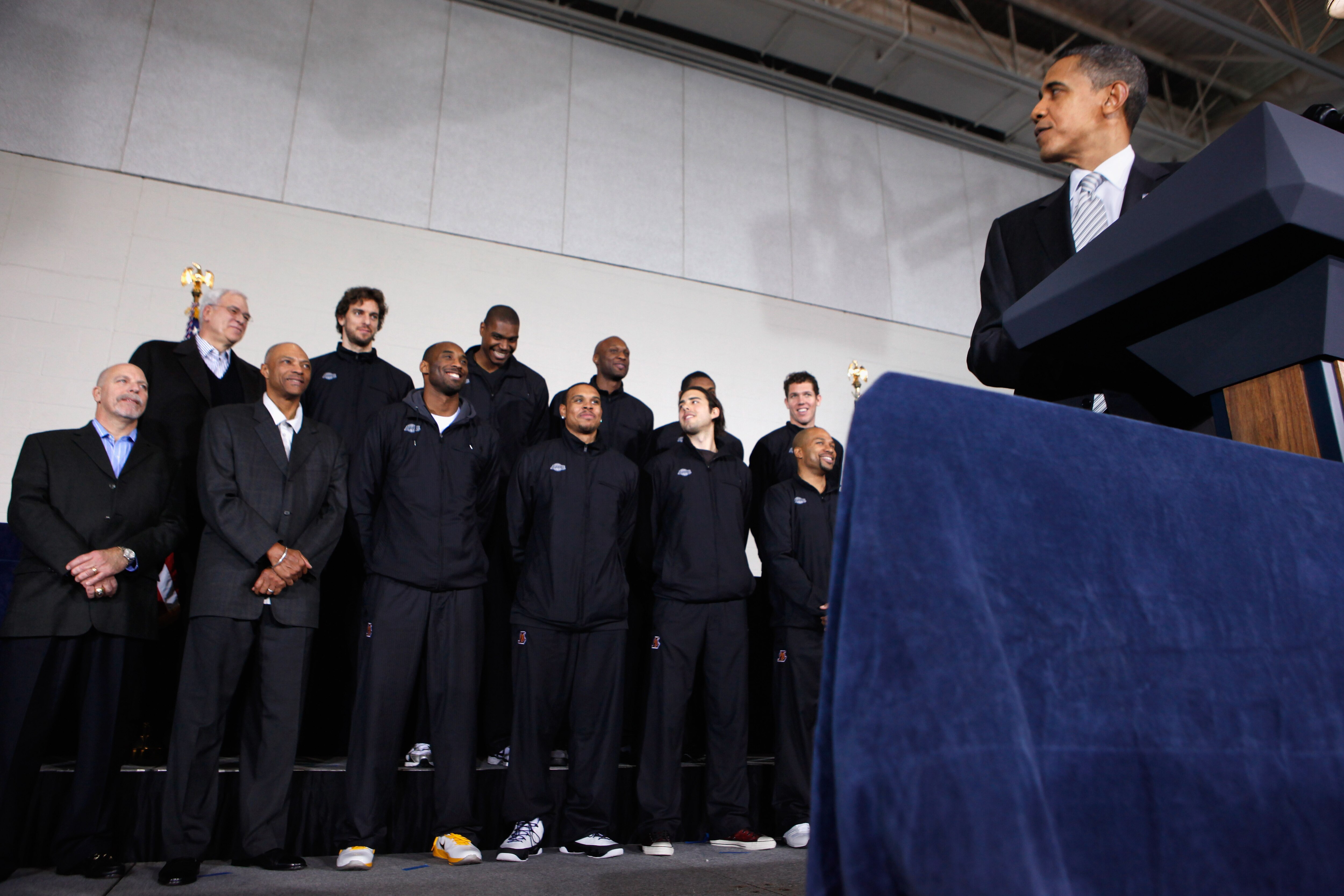 WASHINGTON, DC - DECEMBER 13:  (AFP OUT) U.S. President Barack Obama (R) delivers remarks while congratulating the 2010 NBA Championship Los Angeles Lakers the Boys and Girls Club at THEARC December 13, 2010 in Washington, DC. The Lakers team volunteered