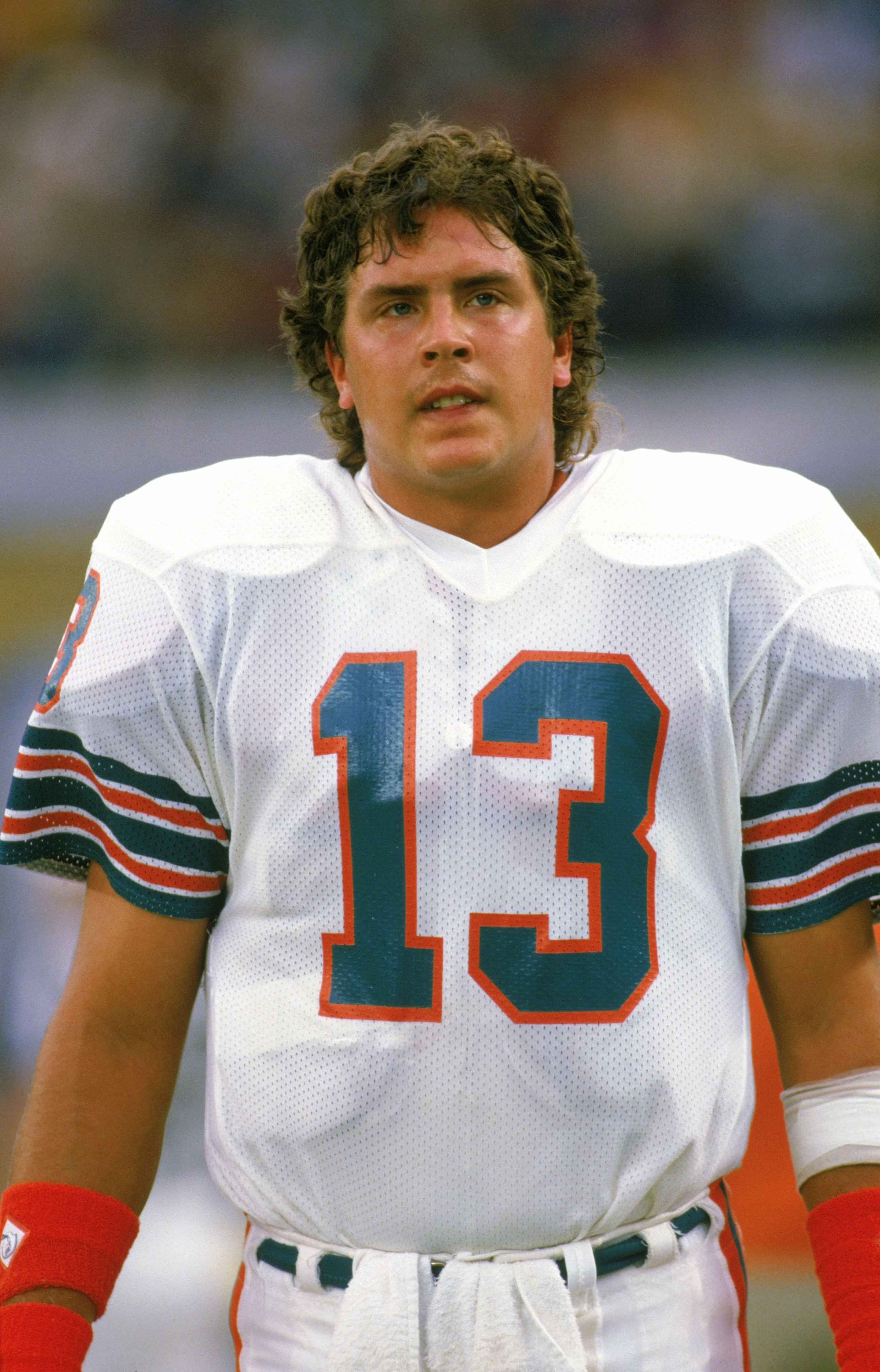 1987:  Quarterback Dan Marino #13 of the Miami Dolphins stands on the sideline during a 1987 season game. (Photo by Rick Stewart/Getty Images)