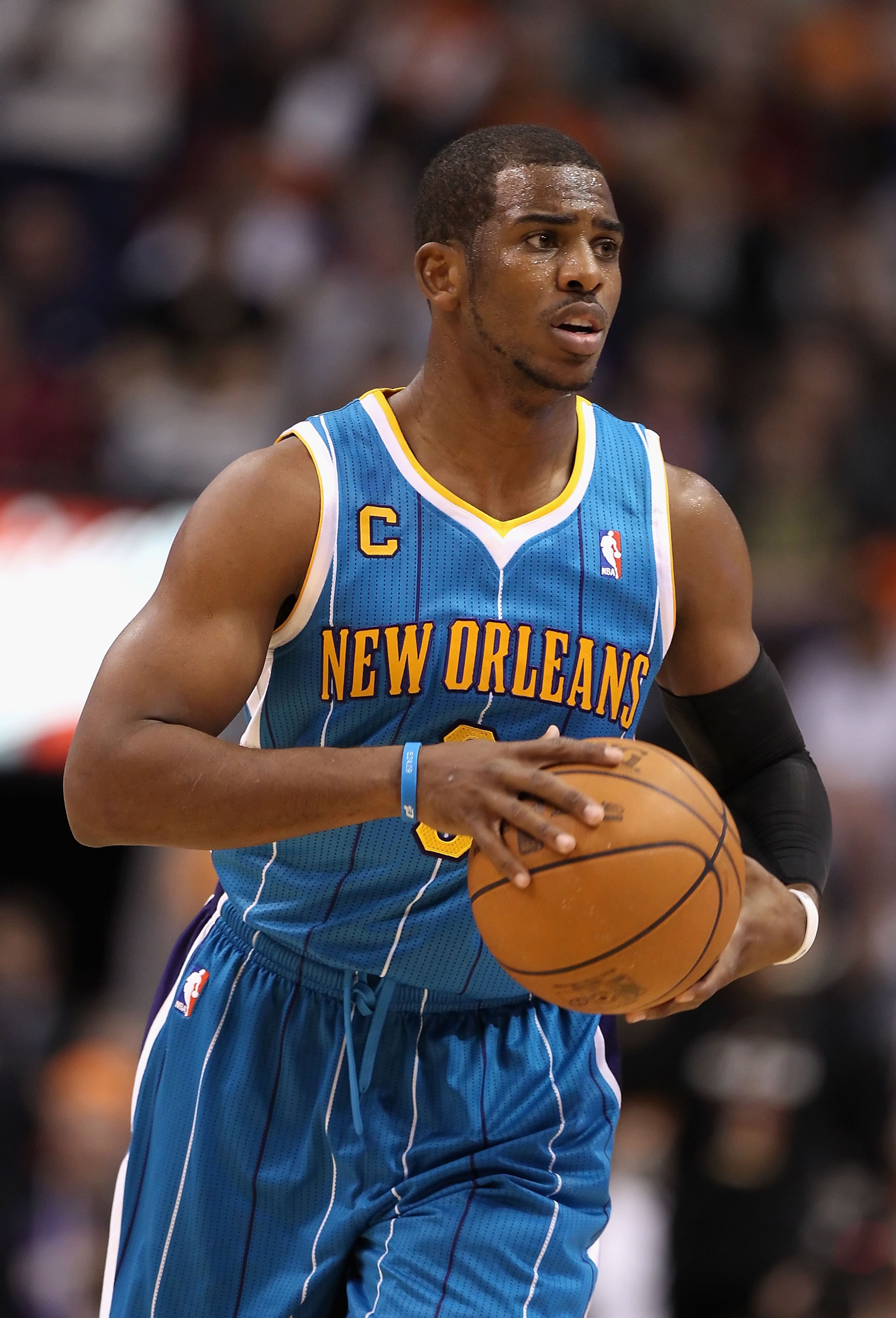 PHOENIX, AZ - JANUARY 30: Chris Paul #3 of the New Orleans Hornets during the NBA game against the Phoenix Suns at US Airways Center on January 30, 2011 in Phoenix, Arizona. The Suns defeated the Hornets 104-102. NOTE TO USER: User expressly acknowledg PHOENIX, AZ - JANUARY 30: Chris Paul #3 of the New Orleans Hornets during the NBA game against the Phoenix Suns at US Airways Center on January 30, 2011 in Phoenix, Arizona. The Suns defeated the Hornets 104-102. NOTE TO USER: User expressly acknowledg