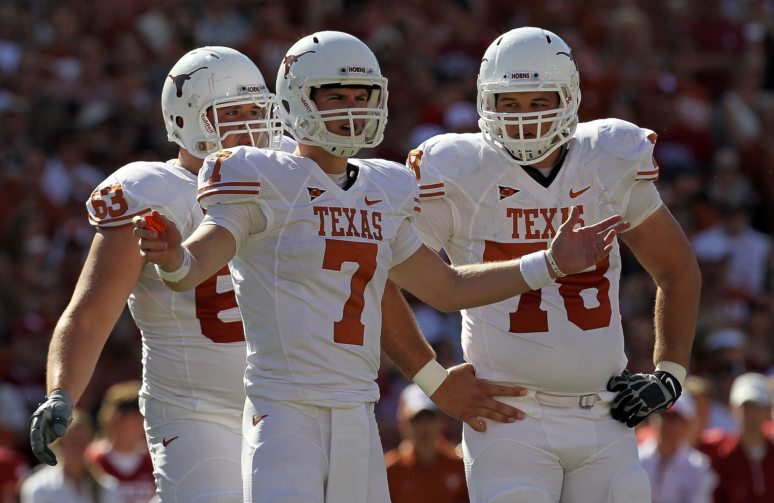 DALLAS - OCTOBER 02: Quarterback Garrett Gilbert #7 of the Texas Longhorns reacts during play against the Oklahoma Sooners at the Cotton Bowl on October 2, 2010 in Dallas, Texas. (Photo by Ronald Martinez/Getty Images) DALLAS - OCTOBER 02: Quarterback Garrett Gilbert #7 of the Texas Longhorns reacts during play against the Oklahoma Sooners at the Cotton Bowl on October 2, 2010 in Dallas, Texas. (Photo by Ronald Martinez/Getty Images)