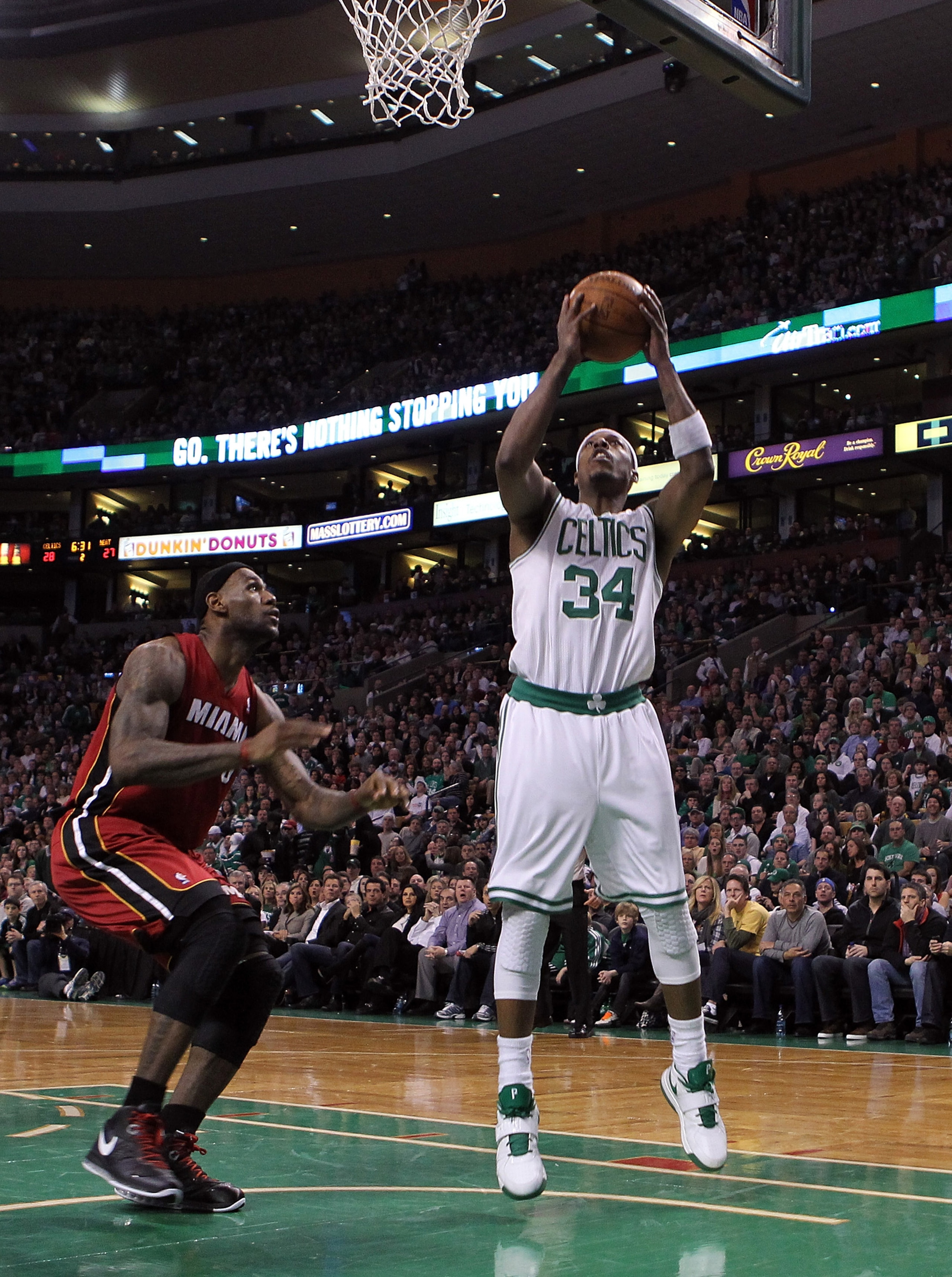 BOSTON - FEBRUARY 13: LeBron James #6 of the Miami Heat defends as Paul Pierce #34 of the Boston Celtics shots a basket at TD Garden on February 13, 2011 in Boston, Massachusetts. NOTE TO USER: User expressly acknowledges and agrees that, by downloading BOSTON - FEBRUARY 13: LeBron James #6 of the Miami Heat defends as Paul Pierce #34 of the Boston Celtics shots a basket at TD Garden on February 13, 2011 in Boston, Massachusetts. NOTE TO USER: User expressly acknowledges and agrees that, by downloading