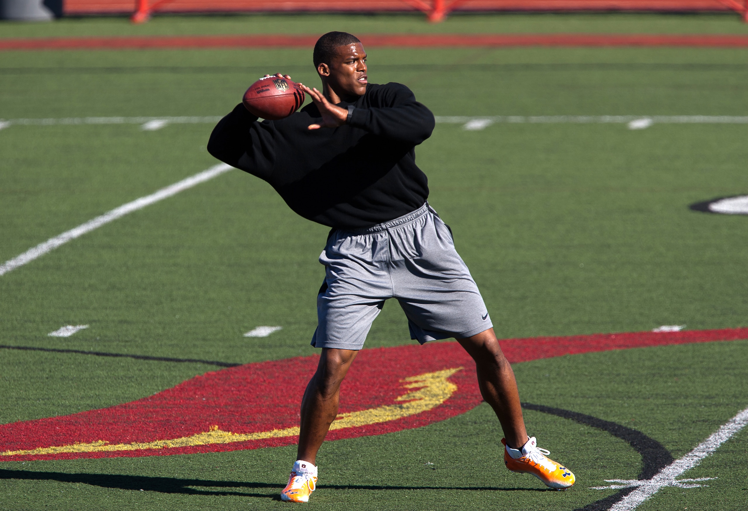 SAN DIEGO, CA - FEBRUARY 10: 2010 Heisman Trophy winning quarterback Cam Newton of Auburn throws the ball during his workout routine for the media at Cathedral High School's sports stadium on February 10, 2011 in San Diego, California. (Photo by Kent Horn SAN DIEGO, CA - FEBRUARY 10: 2010 Heisman Trophy winning quarterback Cam Newton of Auburn throws the ball during his workout routine for the media at Cathedral High School's sports stadium on February 10, 2011 in San Diego, California. (Photo by Kent Horn