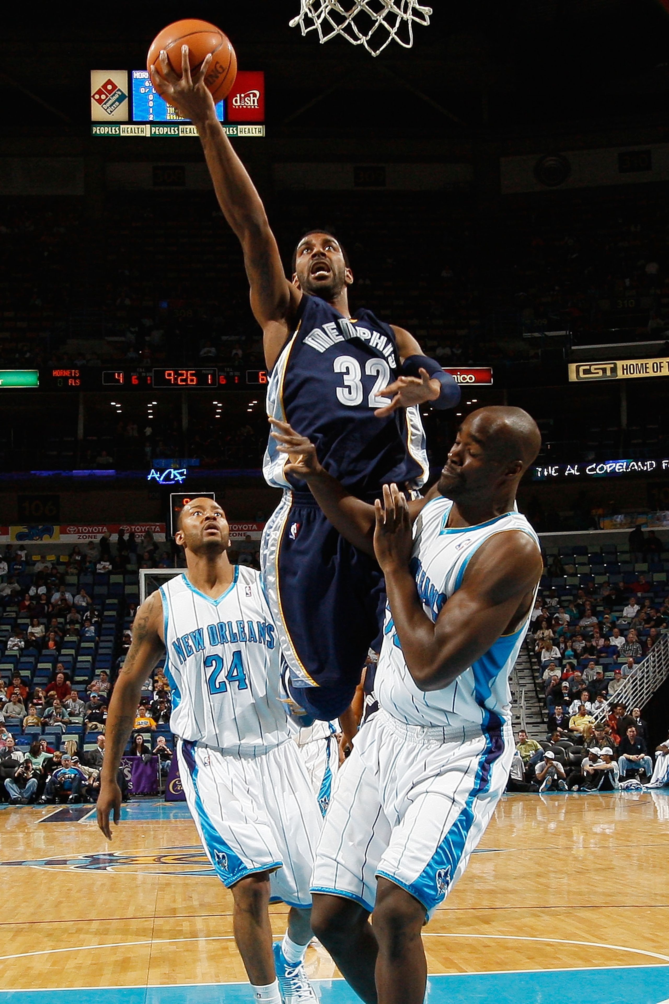 NEW ORLEANS - MARCH 03:  O.J. Mayo #32 of the Memphis Grizzlies makes a shot over Emeka Okafor #50 of the New Orleans Hornets at the New Orleans Arena on March 3, 2010 in New Orleans, Louisiana.  NOTE TO USER: User expressly acknowledges and agrees that,
