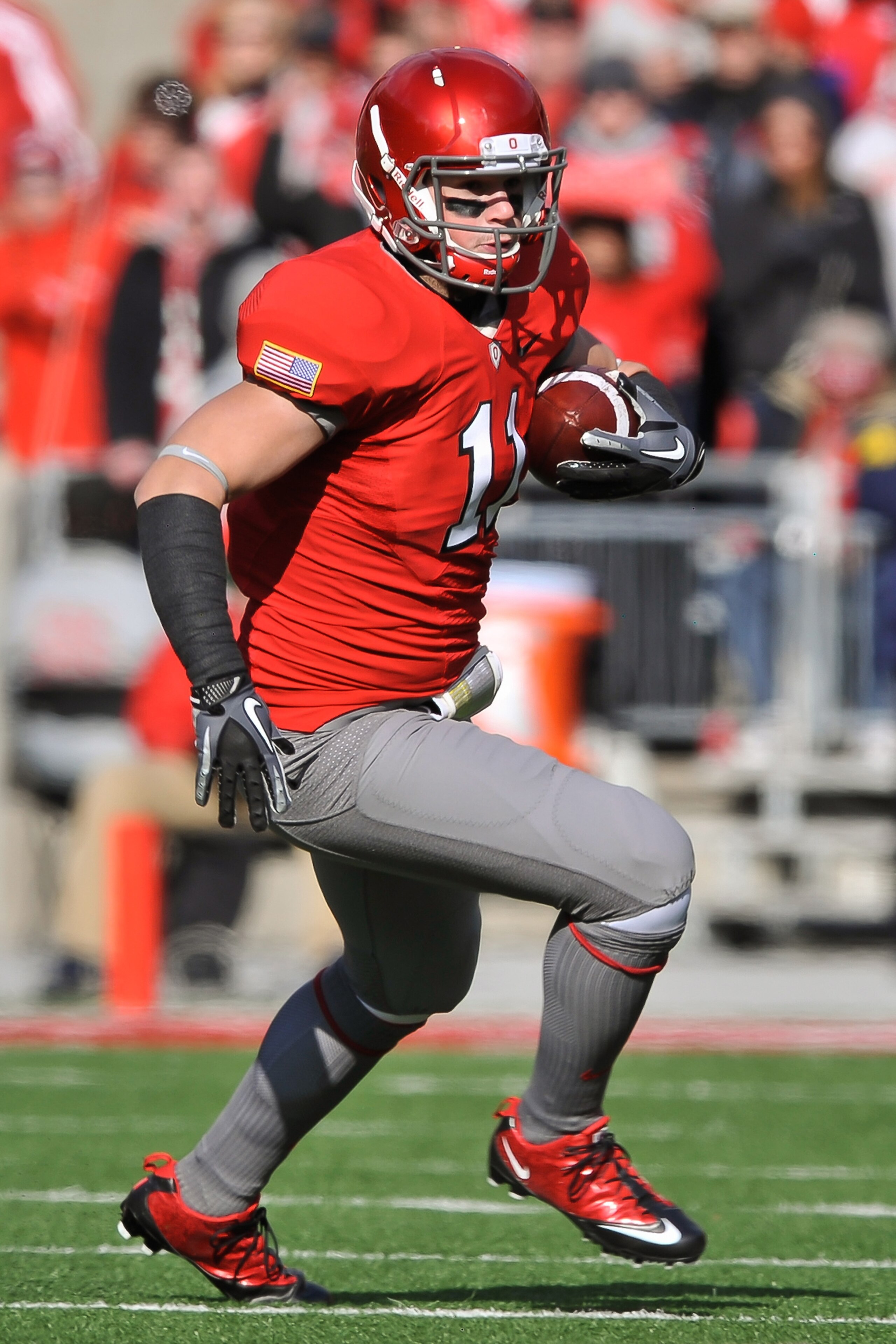 COLUMBUS, OH - NOVEMBER 27:  Jake Stoneburner #11 of the Ohio State Buckeyes runs with the ball against the Michigan Wolverines at Ohio Stadium on November 27, 2010 in Columbus, Ohio.  (Photo by Jamie Sabau/Getty Images)