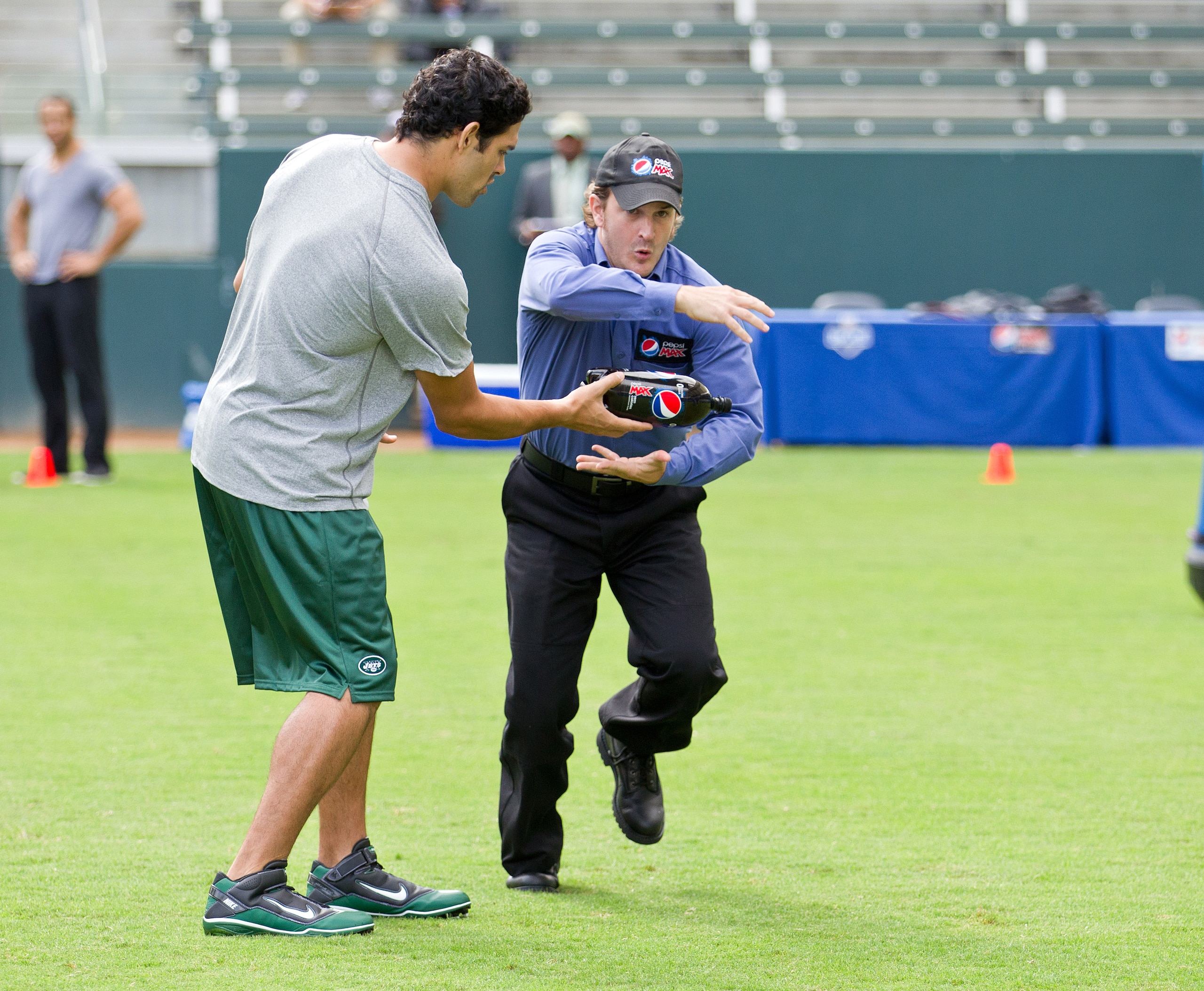 CARSON, CA - OCTOBER 22:  New York Jets quarterback Mark Sanchez shoots a scene with the Pepsi MAX driver on the set of the new zero calorie Pepsi MAX NFL commercial at The Home Depot Center on October 22, 2010 in Carson, California. The ad, which debuts