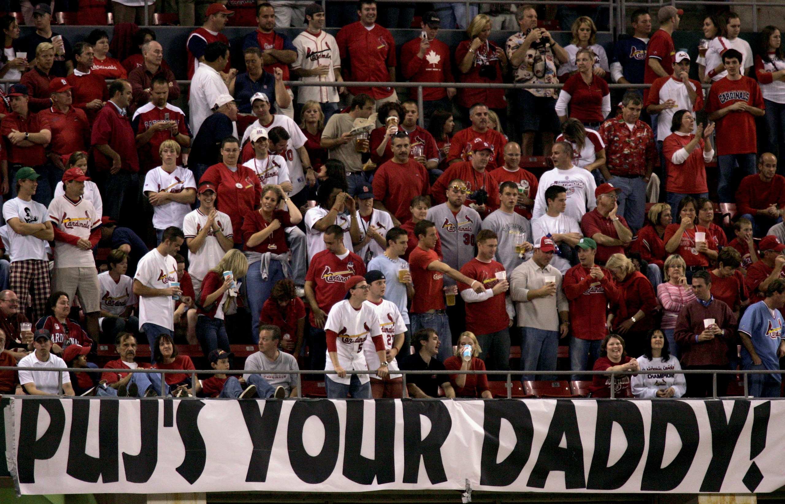ST. LOUIS - OCTOBER 19:  St. Louis Cardinals fans hold up a sign supporting Albert Pujols #5 during the first inning of Game Six of the National League Championship Series against the Houston Astros on October 19, 2005 at Busch Stadium in St. Louis, Misso
