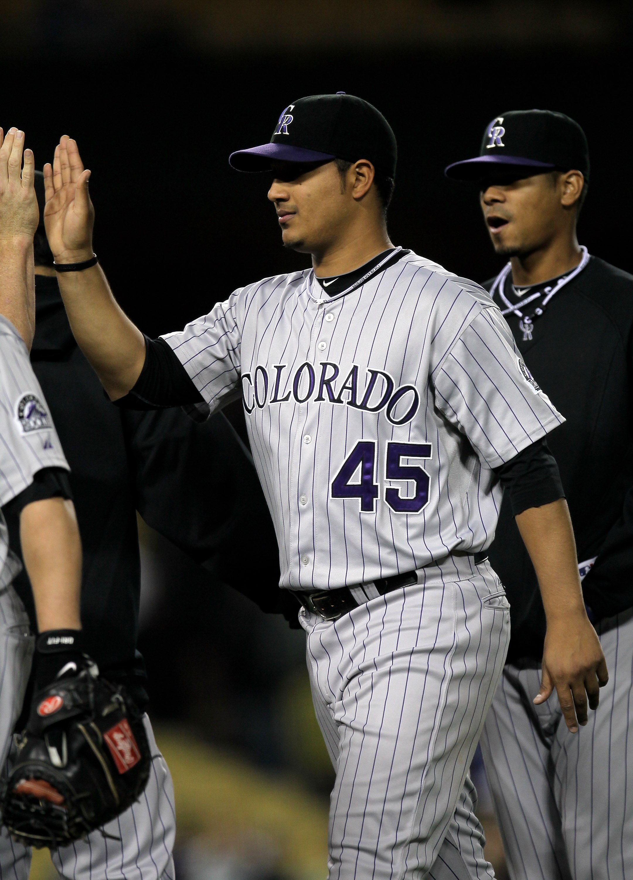 LOS ANGELES, CA - MAY 08:  Pitcher Jhoulys Chacin #45 of the Colorado Rockies celebrates with teammates after the game against the Los Angeles Dodgers on May 8, 2010 at Dodger Stadium in Los Angeles, California. Chacin pitched 7 1/3 shoutout innings as th