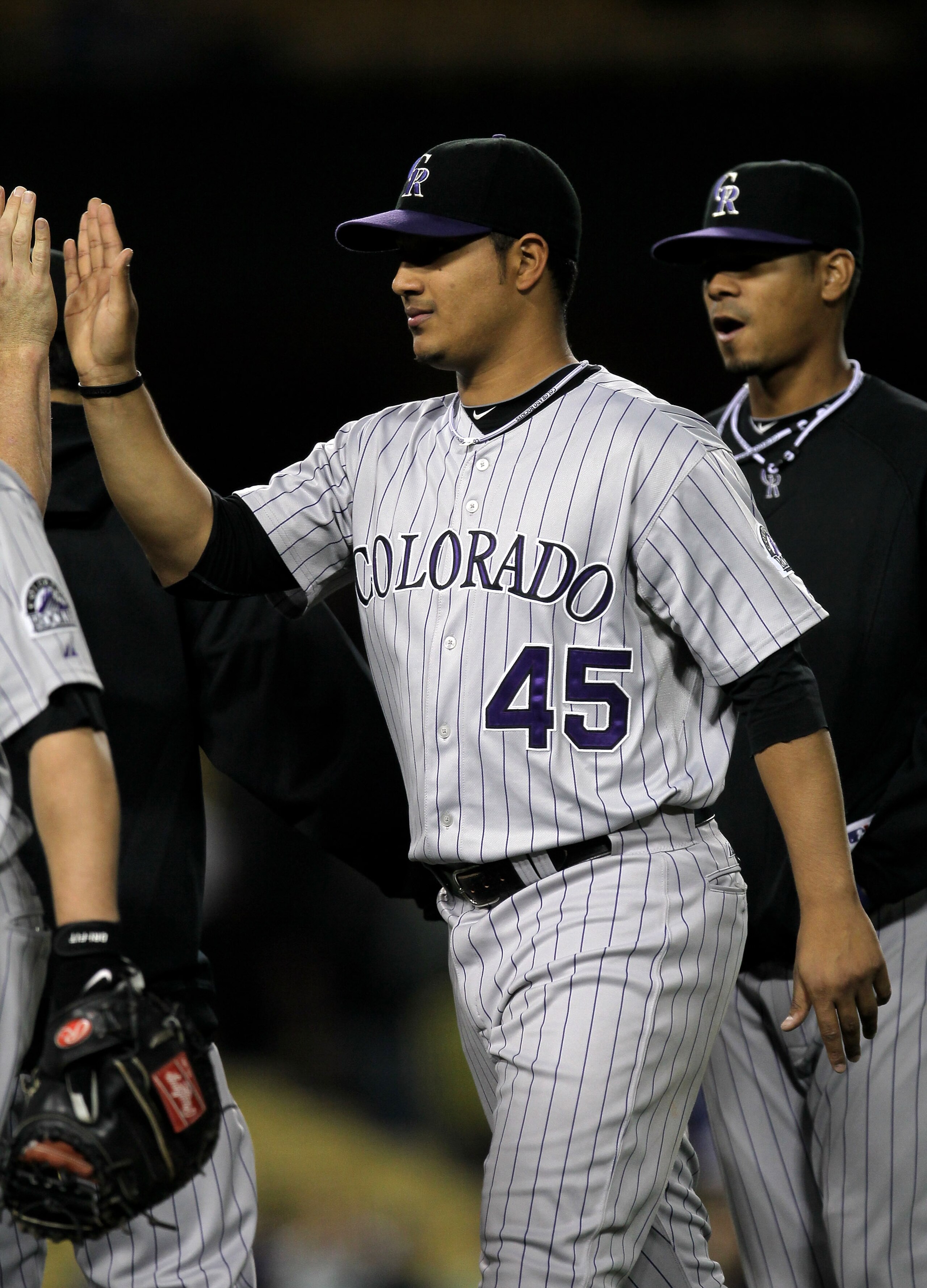 LOS ANGELES, CA - MAY 08:  Pitcher Jhoulys Chacin #45 of the Colorado Rockies celebrates with teammates after the game against the Los Angeles Dodgers on May 8, 2010 at Dodger Stadium in Los Angeles, California. Chacin pitched 7 1/3 shoutout innings as th