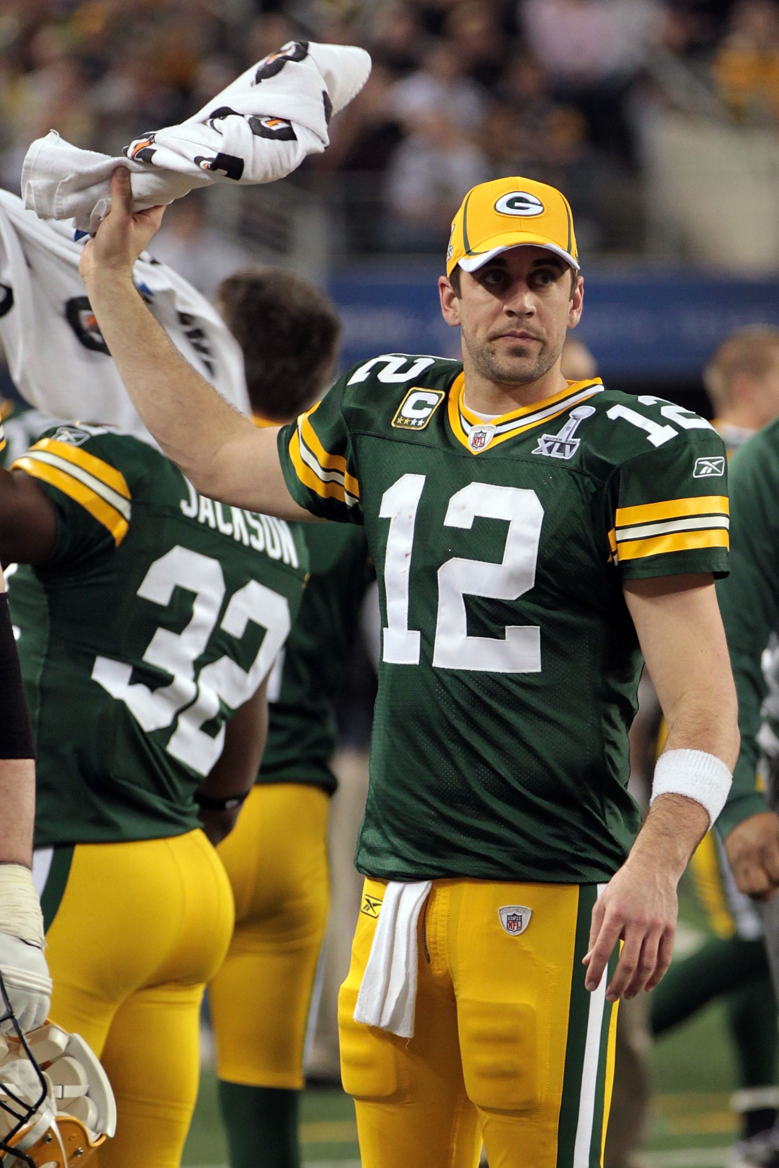 ARLINGTON, TX - FEBRUARY 06: Quarterback Aaron Rodgers #12 of the Green Bay Packers reacts from the sideline in the fourth quarter against the Pittsburgh Steelers during Super Bowl XLV at Cowboys Stadium on February 6, 2011 in Arlington, Texas. (Photo b ARLINGTON, TX - FEBRUARY 06: Quarterback Aaron Rodgers #12 of the Green Bay Packers reacts from the sideline in the fourth quarter against the Pittsburgh Steelers during Super Bowl XLV at Cowboys Stadium on February 6, 2011 in Arlington, Texas. (Photo b