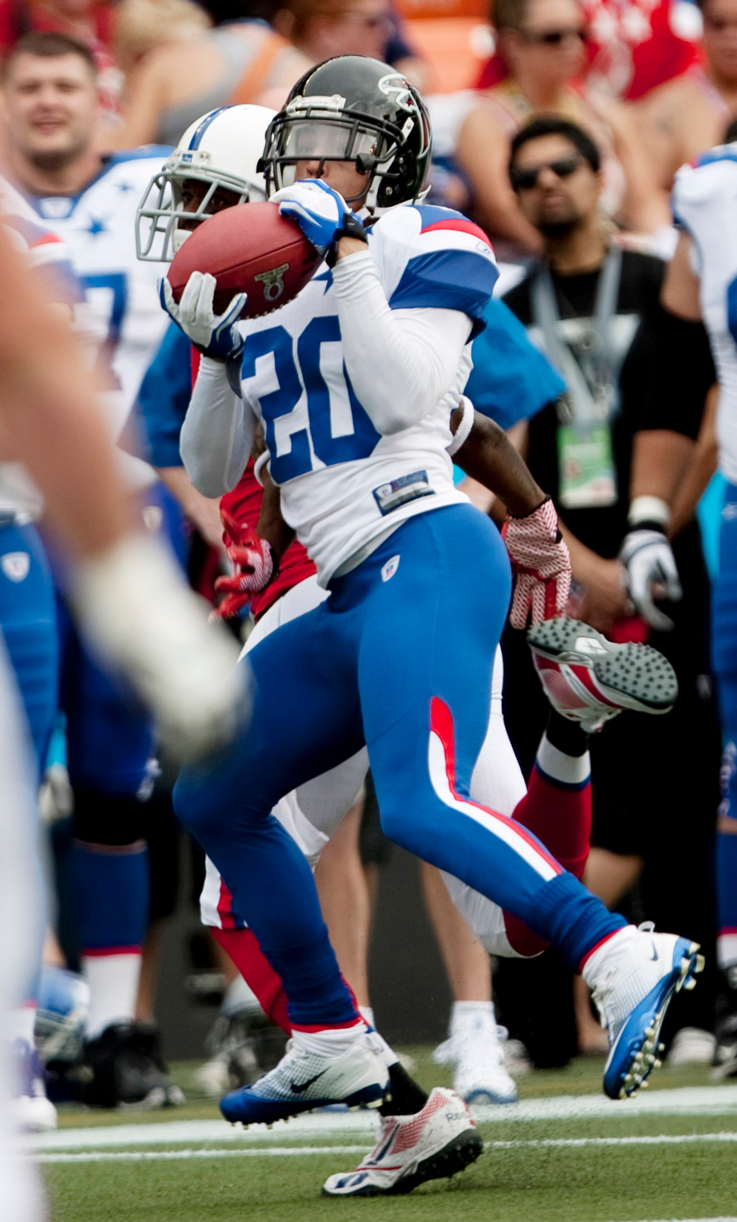 HONOLULU - JANUARY 30:  Brent Grimes #20 of the Atlanta Falcons catches a pass during the 2011 NFL Pro Bowl against the American Football Conference (AFC) at Aloha Stadium on January 30, 2011 in Honolulu, Hawaii.  (Photo by Kent Nishimura/Getty Images)