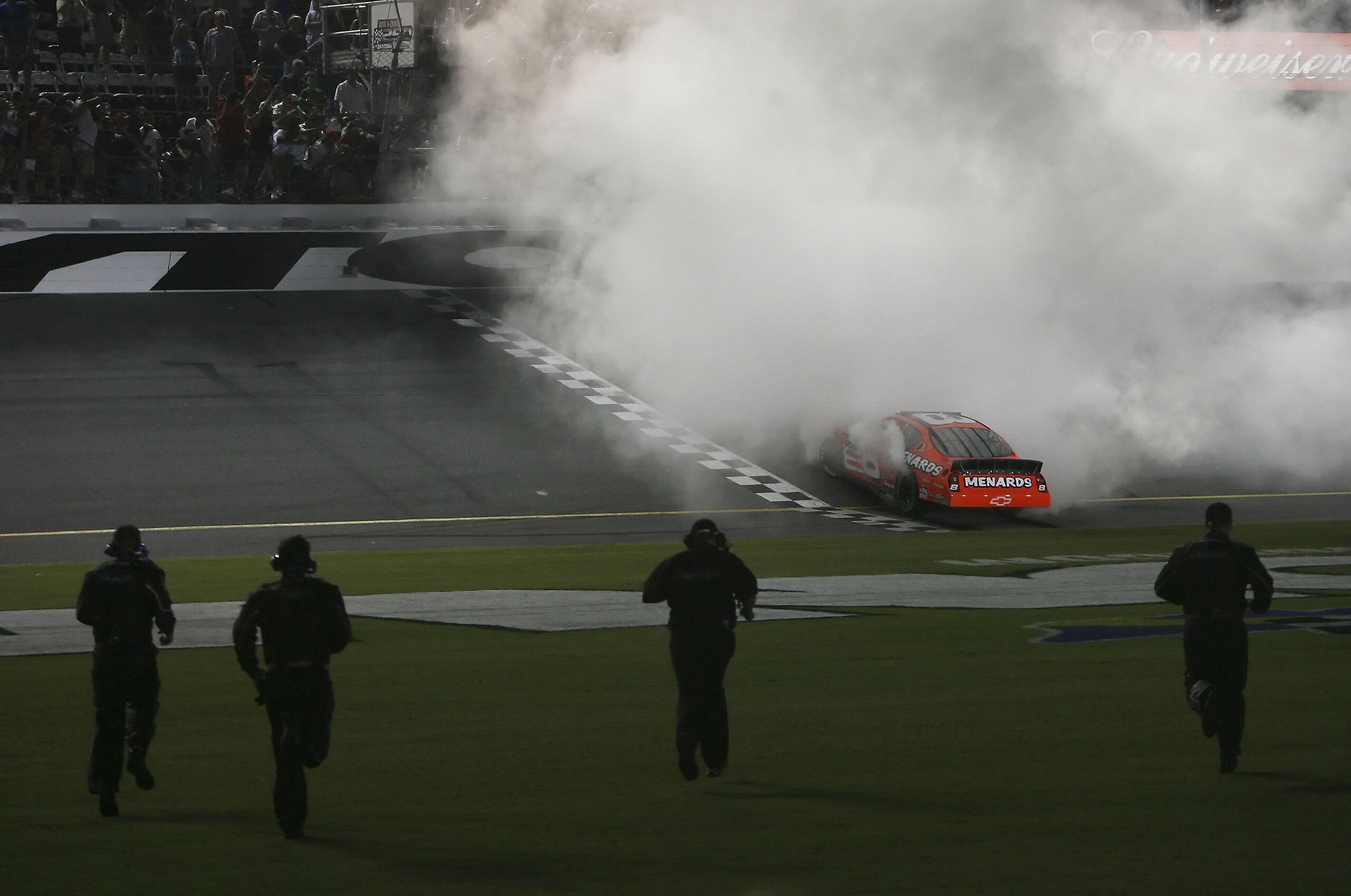 DAYTONA BEACH, FL - JUNE 30: Dale Earnhardt Jr., driver of the Menards/Johns Manville Chevrolet car, does a burn out in celebration of winning the NASCAR Busch Series Winn-Dixie 250 on June 30, 2006 at Daytona International Speedway in Daytona, Florida DAYTONA BEACH, FL - JUNE 30: Dale Earnhardt Jr., driver of the Menards/Johns Manville Chevrolet car, does a burn out in celebration of winning the NASCAR Busch Series Winn-Dixie 250 on June 30, 2006 at Daytona International Speedway in Daytona, Florida