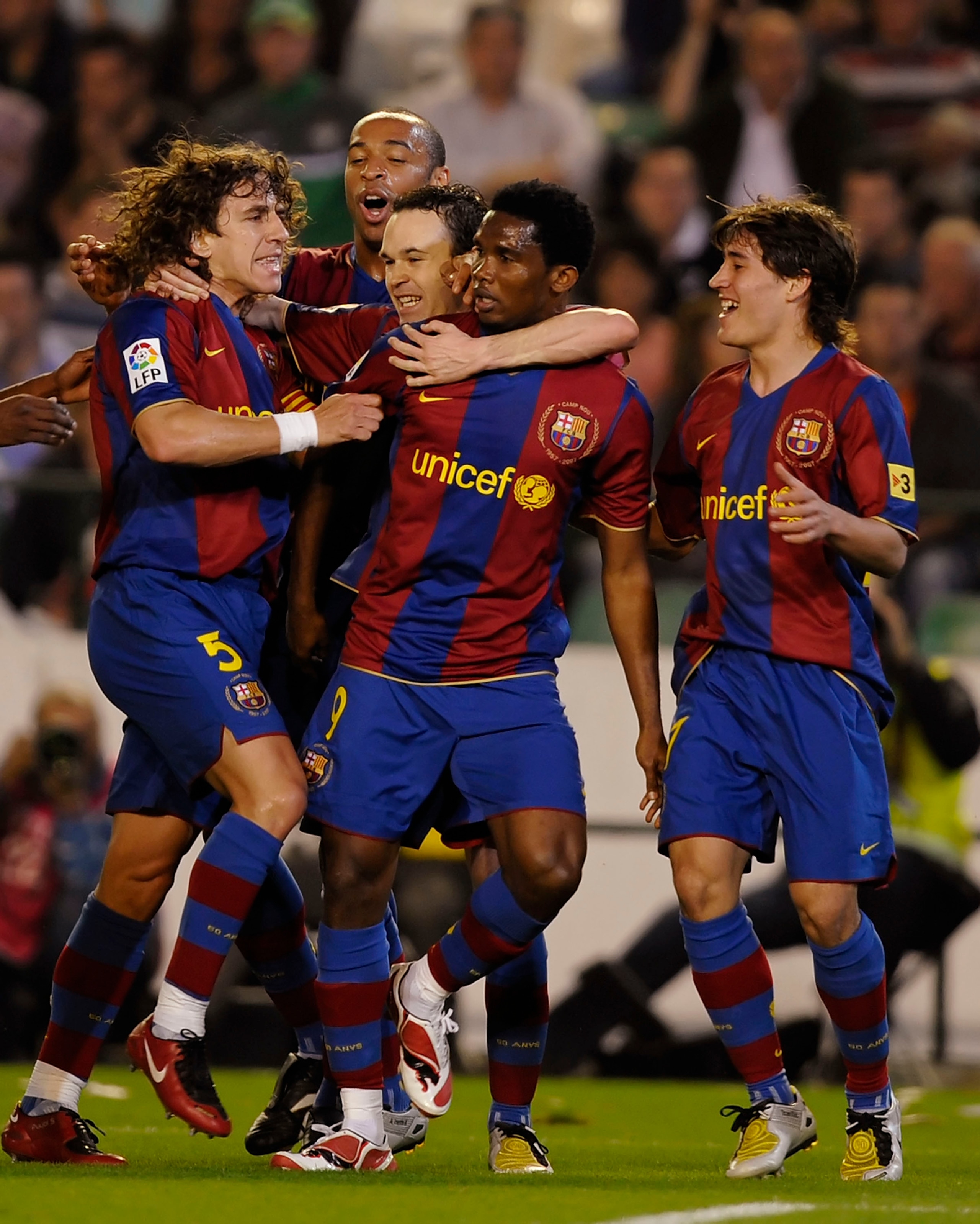 SEVILLE, SPAIN - MARCH 29: Samuel Eto'o (C) of Barcelona celebrates with Carles Puyol (L) and Andres Iniesta after he scored their second goal during the La Liga match between Real Betis and Barcelona at the Manuel Ruiz de Lopera stadium on March 29, 2008 SEVILLE, SPAIN - MARCH 29: Samuel Eto'o (C) of Barcelona celebrates with Carles Puyol (L) and Andres Iniesta after he scored their second goal during the La Liga match between Real Betis and Barcelona at the Manuel Ruiz de Lopera stadium on March 29, 2008