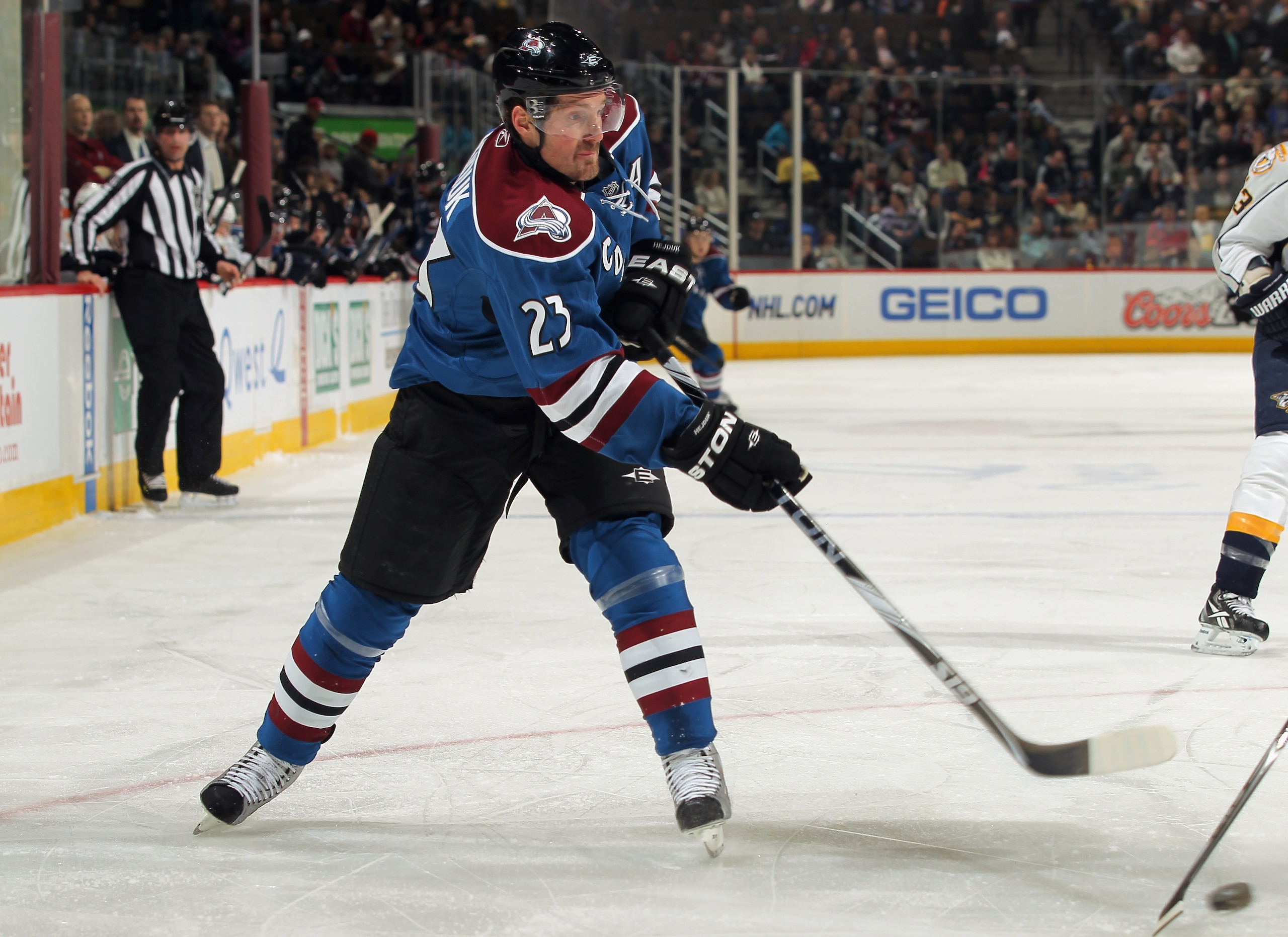 DENVER, CO - JANUARY 20:  Milan Hejduk #23 of the Colorado Avalanche passes the puck against the Nashville Predators battle for control of the puck at the Pepsi Center on January 20, 2011 in Denver, Colorado. The Predators defeated the Avalanche 5-1.  (Ph