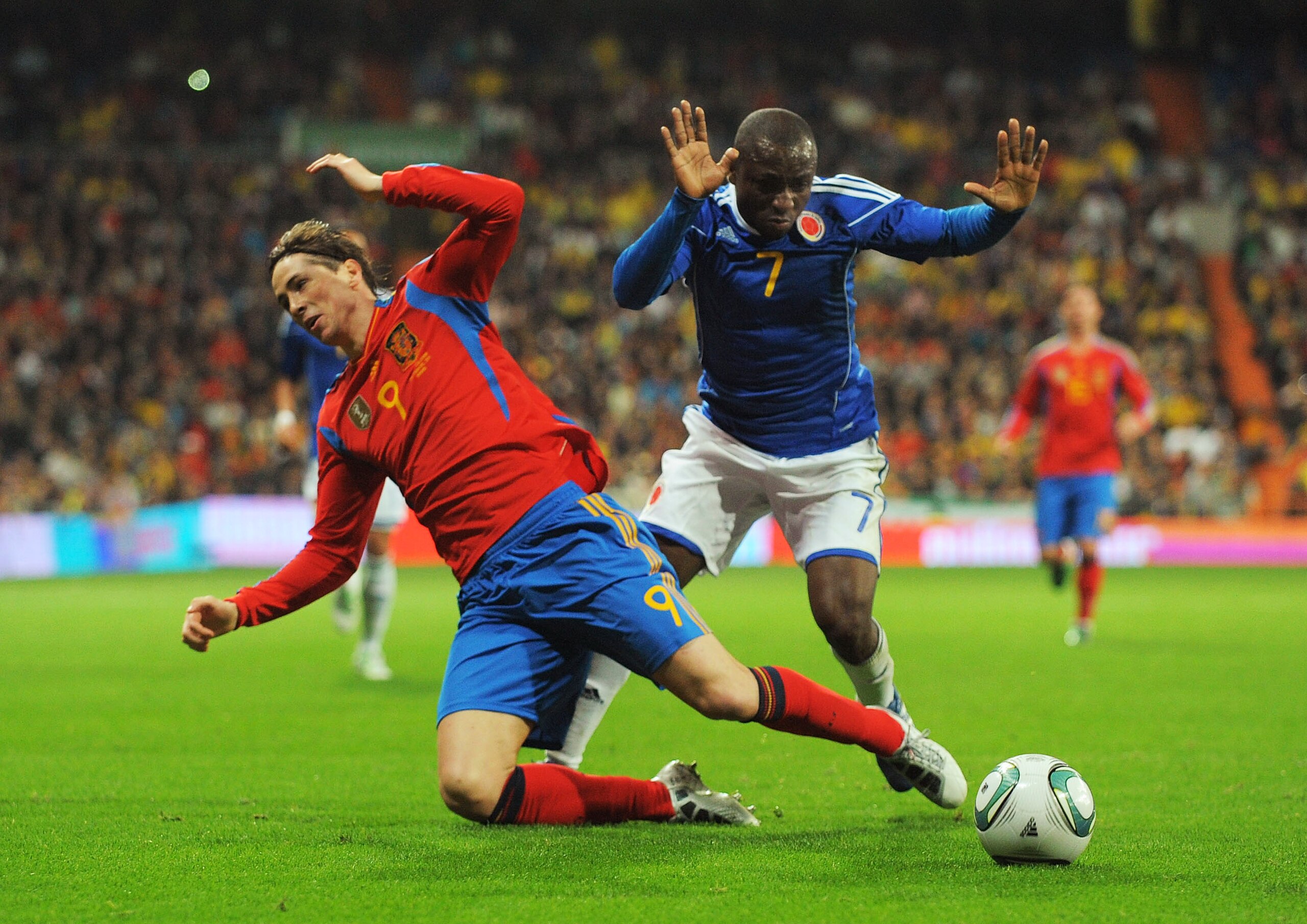MADRID, SPAIN - FEBRUARY 09: Fernando Torres (L) of Spain is fouled by Armero of Colombia during the International friendly match between Spain and Colombia at Estadio Santiago Bernabeu on February 9, 2011 in Madrid, Spain. (Photo by Denis Doyle/Getty MADRID, SPAIN - FEBRUARY 09: Fernando Torres (L) of Spain is fouled by Armero of Colombia during the International friendly match between Spain and Colombia at Estadio Santiago Bernabeu on February 9, 2011 in Madrid, Spain. (Photo by Denis Doyle/Getty