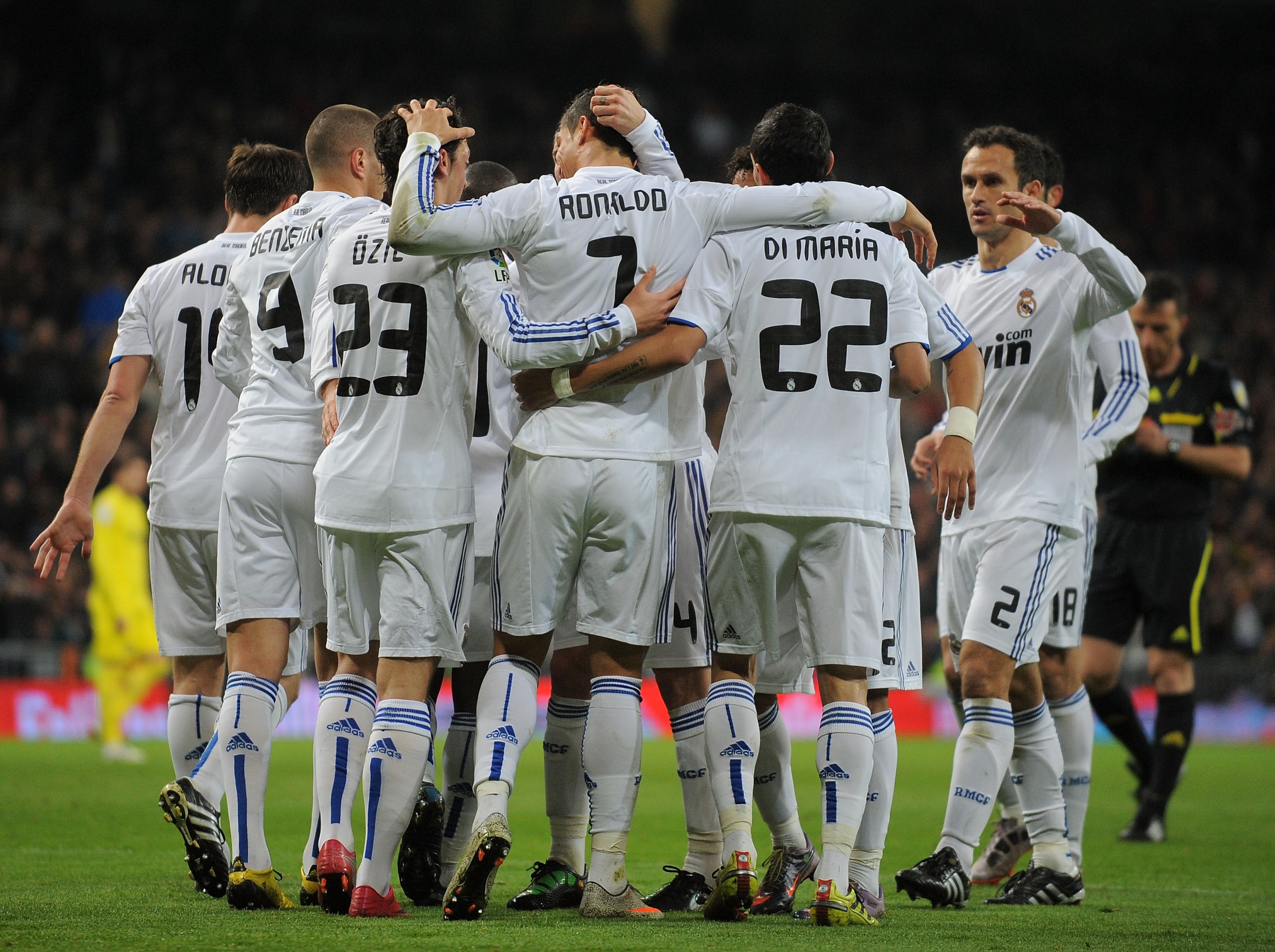 MADRID, SPAIN - JANUARY 09:  Cristiano Ronaldo   of Real Madrid celebrates with teammates after scoring Real's first goal during the La Liga match between Real Madrid and Villarreal at Estadio Santiago Bernabeu on January 9, 2011 in Madrid, Spain.  (Photo
