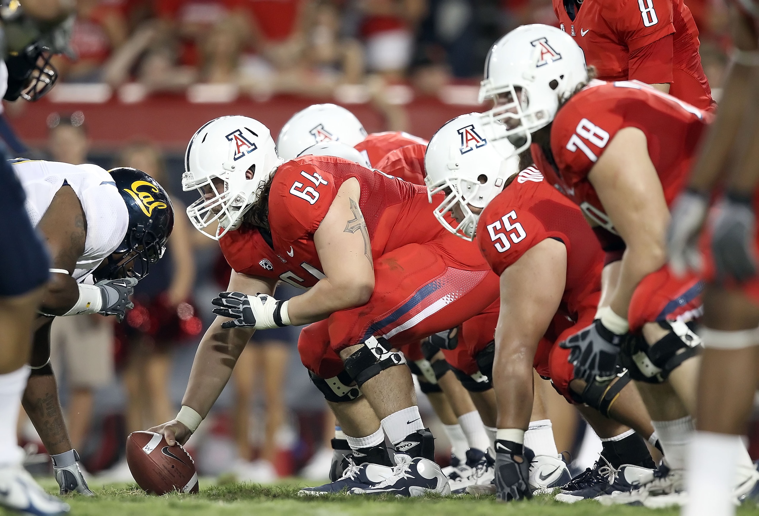 TUCSON, AZ - SEPTEMBER 25:  Center Colin Baxter #64 of the Arizona Wildcats prepares to snap the ball during the college football game against the California Golden Bears at Arizona Stadium on September 25, 2010 in Tucson, Arizona.   The Wildcats defeated