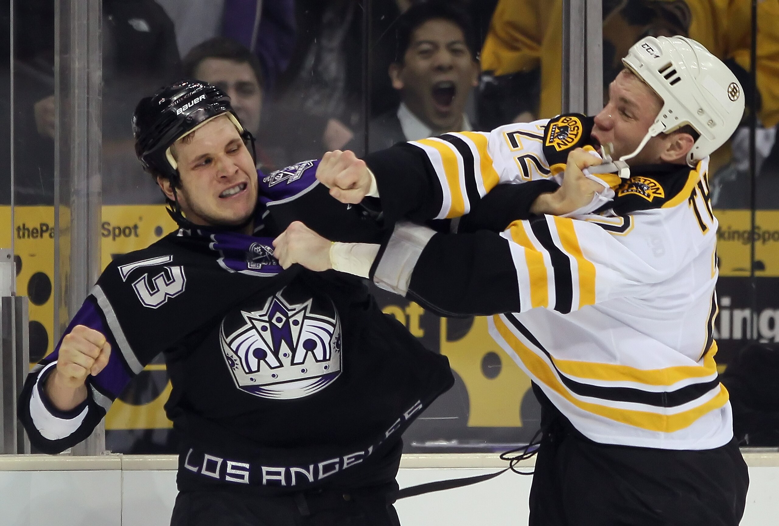 LOS ANGELES, CA - JANUARY 24:  Shawn Thornton #22 of the Boston Bruins and Kyle Clifford #13 of the Los Angeles Kings fight during the first period at Staples Center on January 24, 2011 in Los Angeles, California.  (Photo by Jeff Gross/Getty Images)