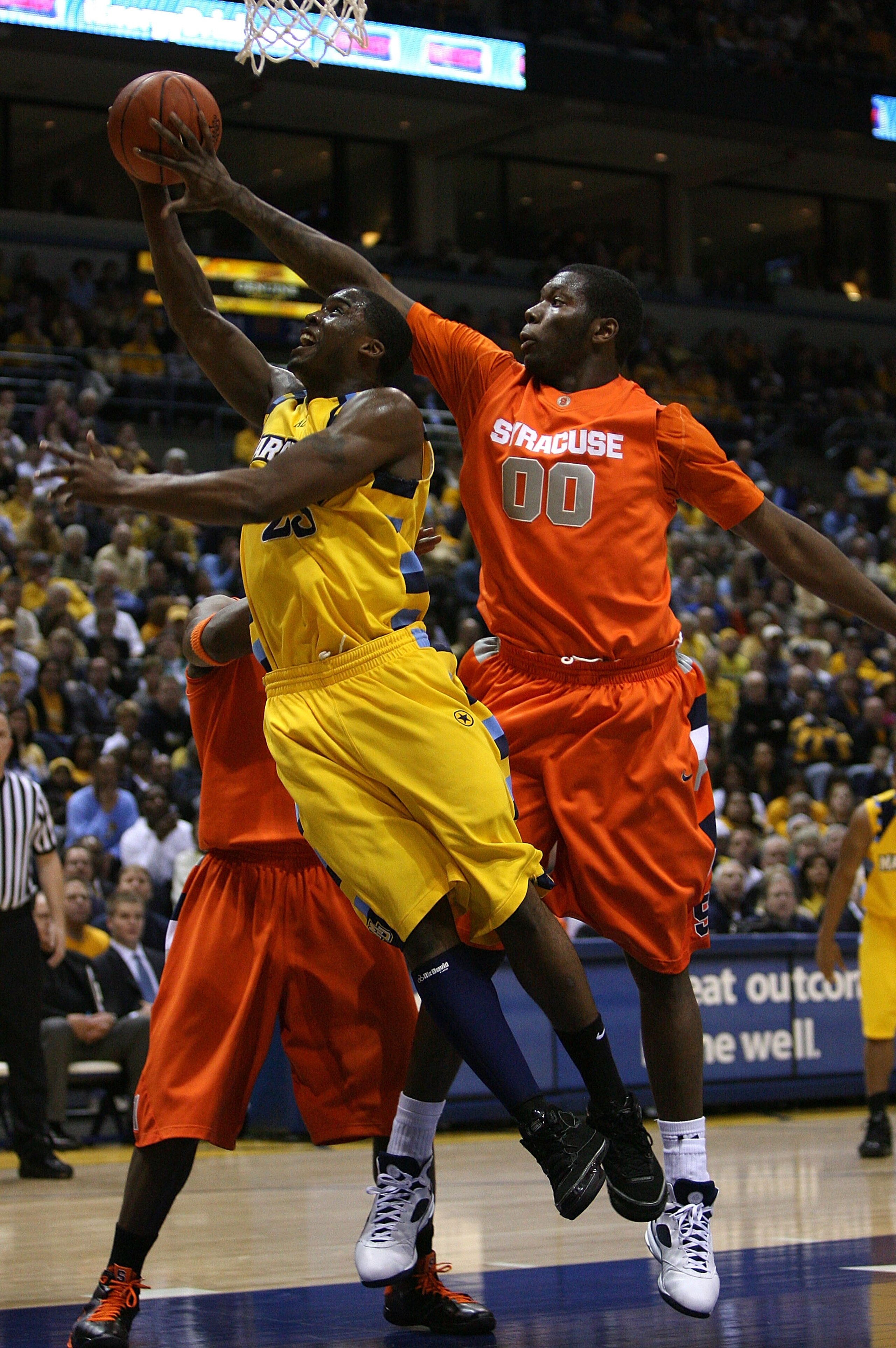MILWAUKEE - MARCH 07: Rick Jackson #00 of the Syracuse Orange blocks a shot attempt by Wesley Matthews #23 of the Marquette Golden Eagles on March 7, 2009 at the Bradley Center in Milwaukee, Wisconsin. (Photo by Jonathan Daniel/Getty Images)
