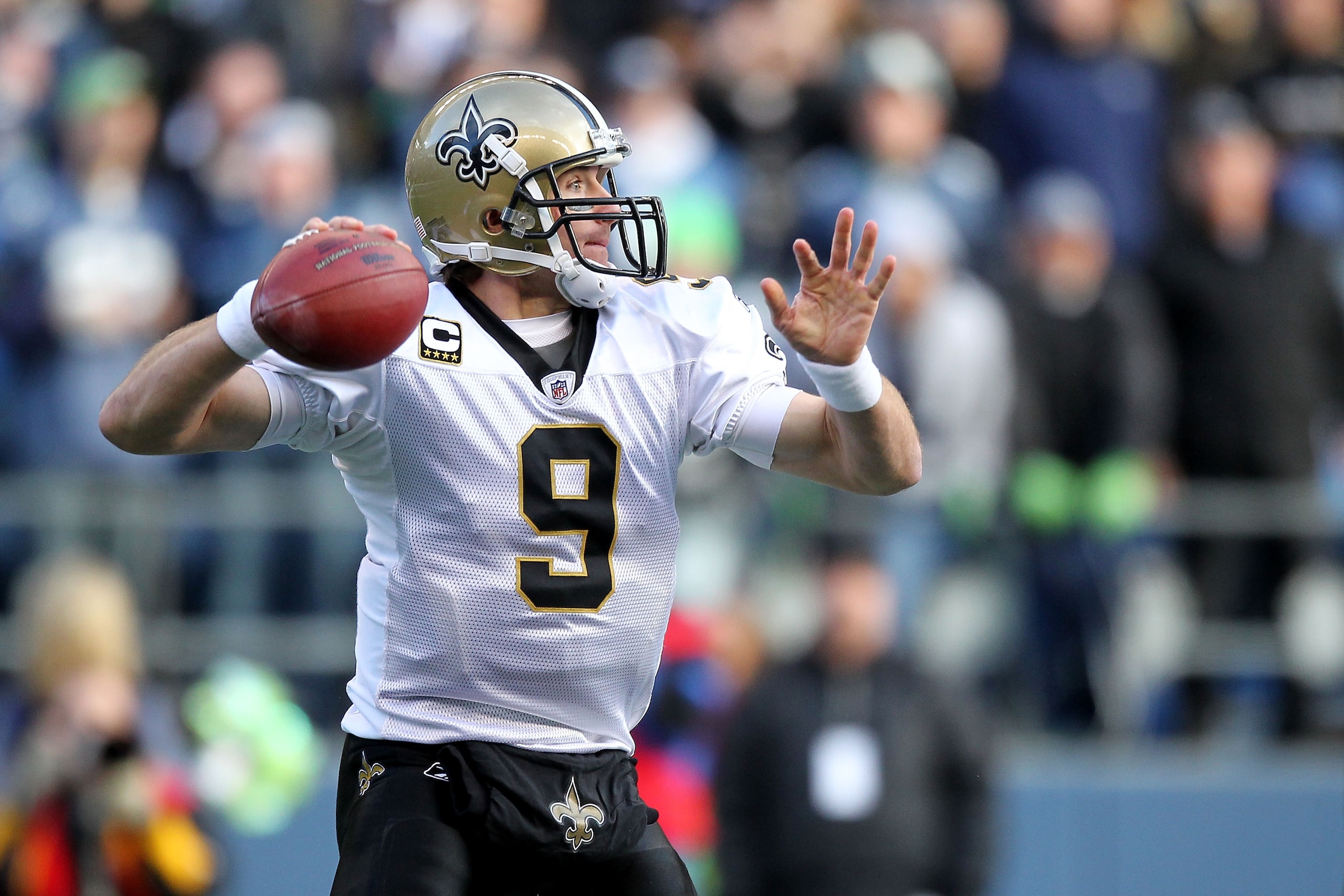 SEATTLE, WA - JANUARY 08:  Quarterback Drew Brees #9 of the New Orleans Saints throws the ball against the Seattle Seahawks during the 2011 NFC wild-card playoff game at Qwest Field on January 8, 2011 in Seattle, Washington.  (Photo by Otto Greule Jr/Gett