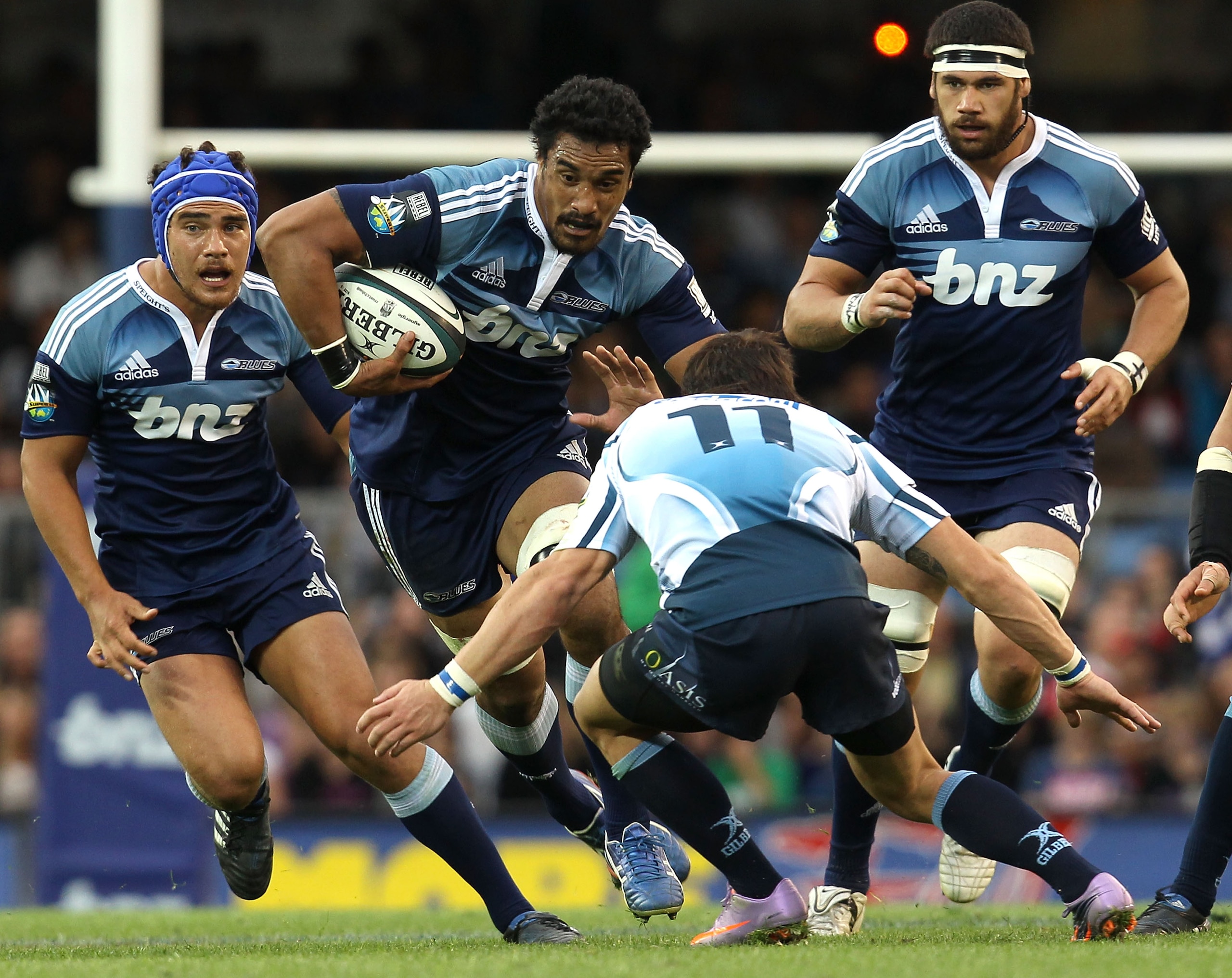 AUCKLAND, NEW ZEALAND - APRIL 03: Jerome Kaino of the Blues fends off Francois Hougaard of the Bulls during the round eight Super 14 match between the Blues and the Bulls at Eden Park on April 3, 2010 in Auckland, New Zealand.  (Photo by Phil Walter/Getty