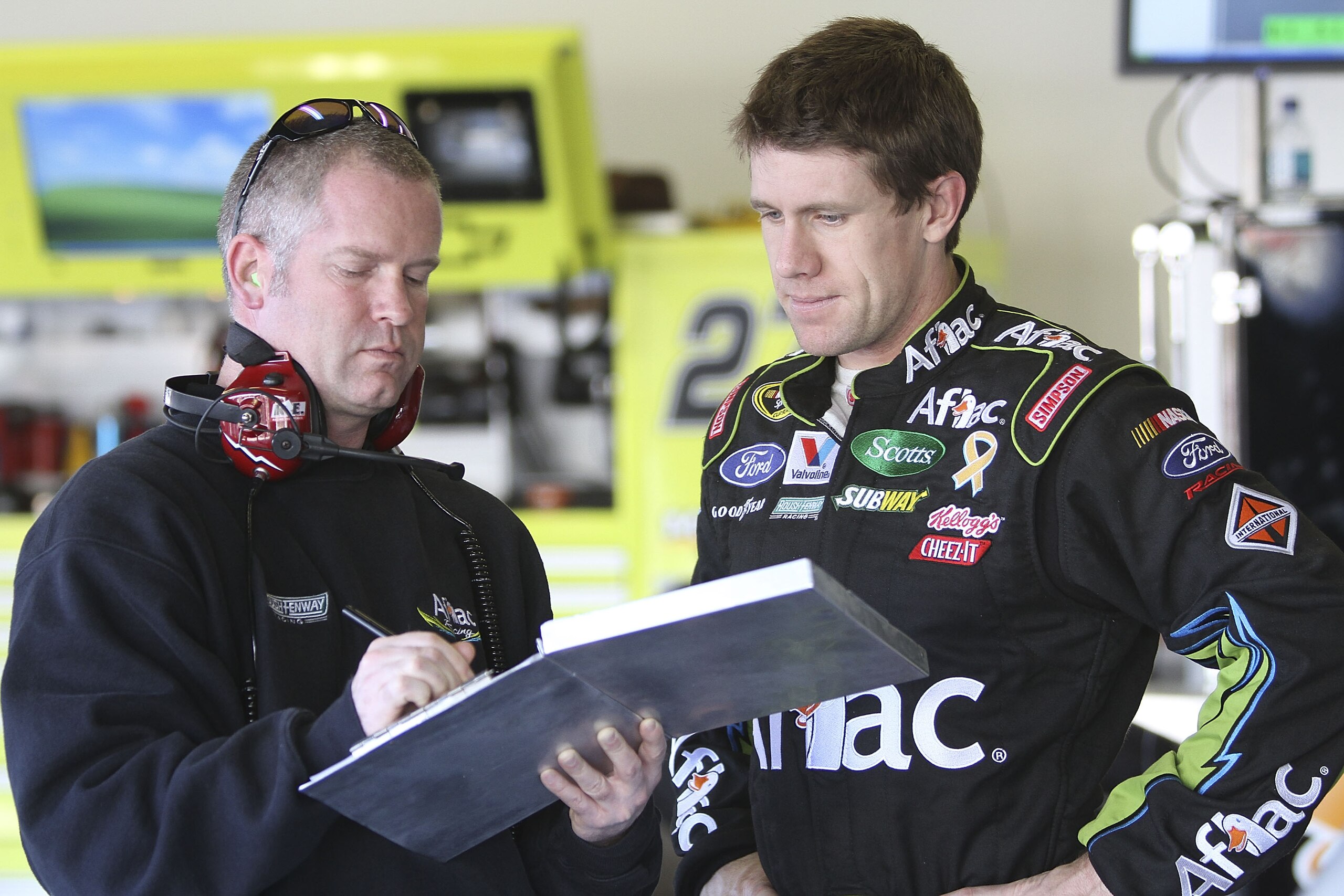 DAYTONA BEACH, FL - JANUARY 20: Carl Edwards, driver of the #99 AFLAC Ford talks with crew chief Bob Osbourne during testing at Daytona International Speedway on January 20, 2011 in Daytona Beach, Florida. (Photo by Jerry Markland/Getty Images for NASCA DAYTONA BEACH, FL - JANUARY 20: Carl Edwards, driver of the #99 AFLAC Ford talks with crew chief Bob Osbourne during testing at Daytona International Speedway on January 20, 2011 in Daytona Beach, Florida. (Photo by Jerry Markland/Getty Images for NASCA