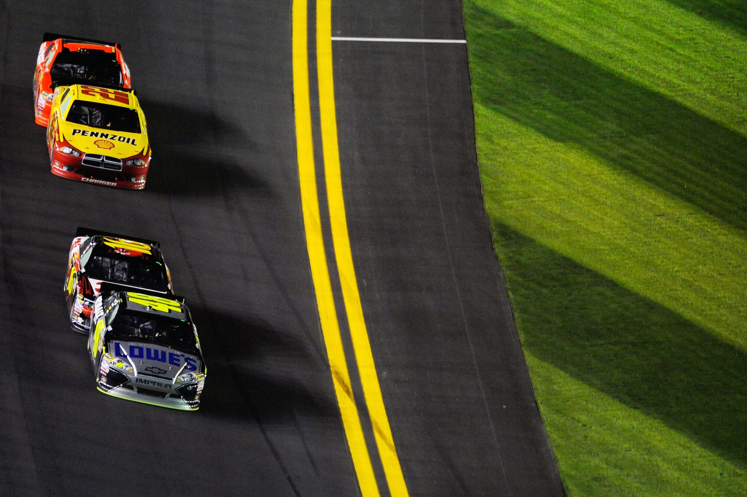 DAYTONA BEACH, FL - FEBRUARY 12: Jimmie Johnson, driver of the #48 Lowe's Chevrolet, leads the field along the frontstretch during the NASCAR Budweiser Shootout at Daytona International Speedway on February 12, 2011 in Daytona Beach, Florida. (Photo by DAYTONA BEACH, FL - FEBRUARY 12: Jimmie Johnson, driver of the #48 Lowe's Chevrolet, leads the field along the frontstretch during the NASCAR Budweiser Shootout at Daytona International Speedway on February 12, 2011 in Daytona Beach, Florida. (Photo by