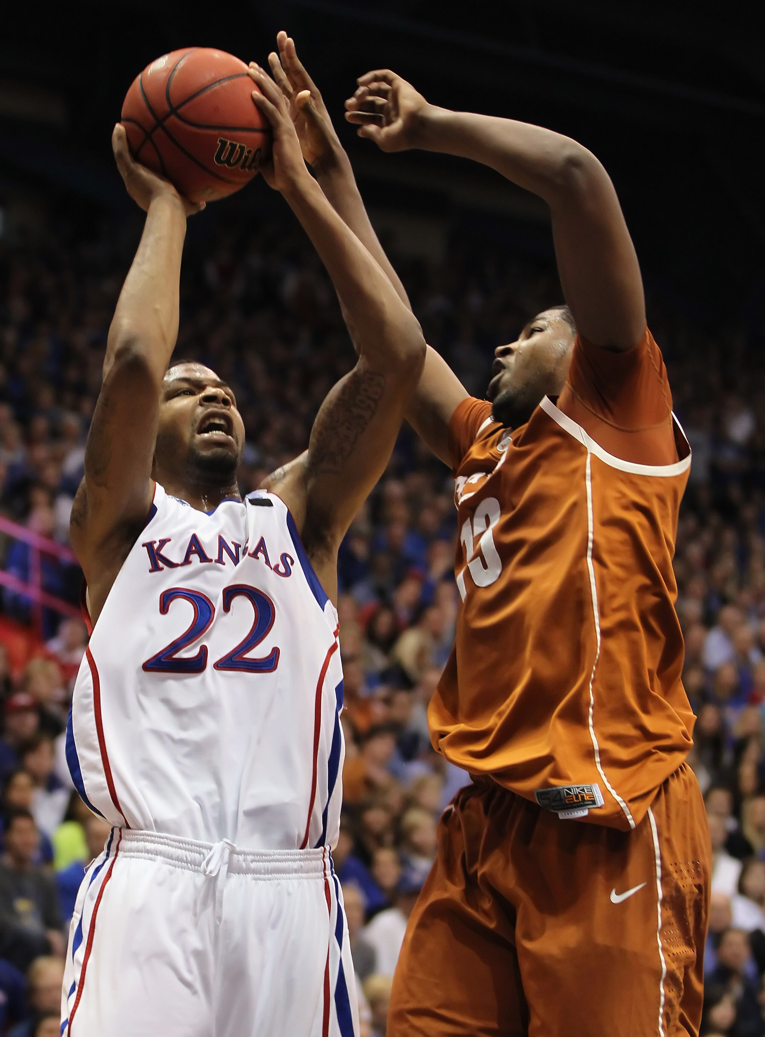 LAWRENCE, KS - JANUARY 22:  Marcus Morris #22 of the Kansas Jayhawks shoots over Tristan Thompson #13 of the Texas Longhorns during the game on January 22, 2011 at Allen Fieldhouse in Lawrence, Kansas.  (Photo by Jamie Squire/Getty Images)