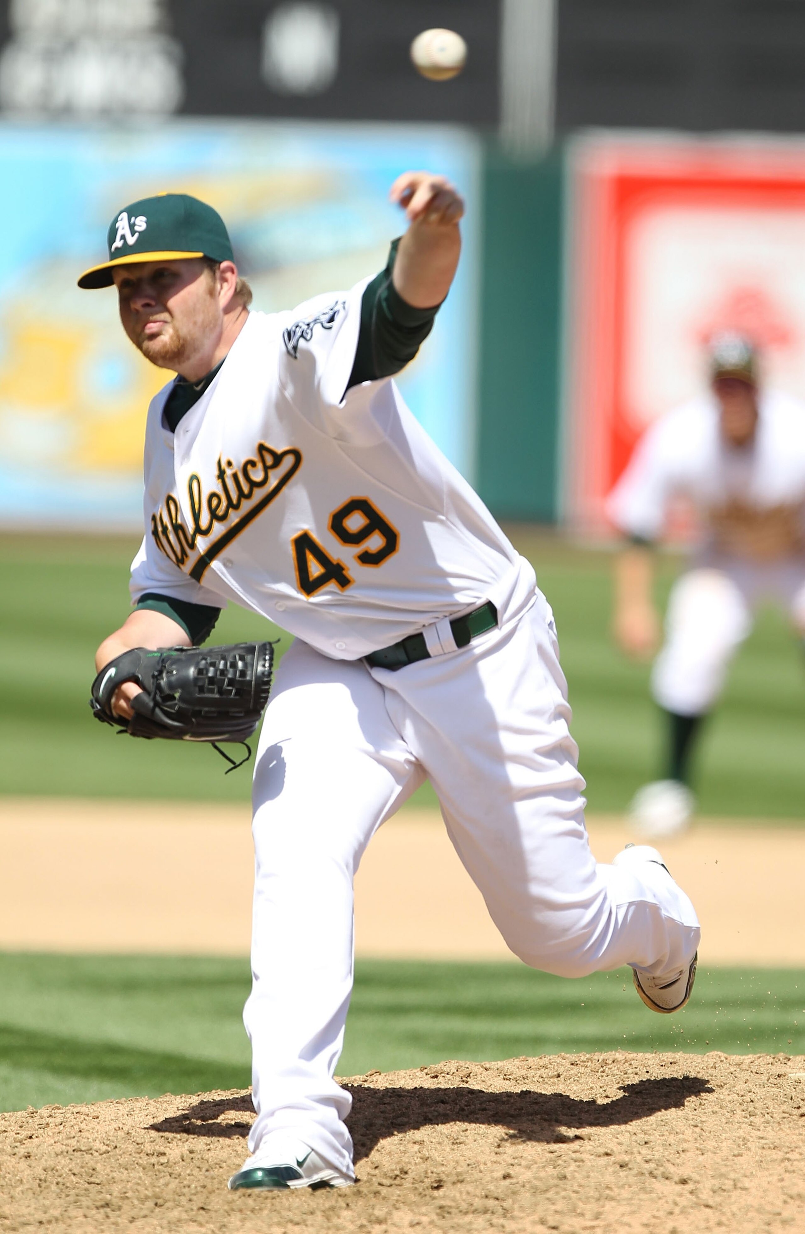 OAKLAND, CA - APRIL 08:  Brett Anderson #49 of the Oakland Athletics pitches against the Seattle Mariners during an MLB game at the Oakland-Alameda County Coliseum on April 8, 2010 in Oakland, California.  (Photo by Jed Jacobsohn/Getty Images)