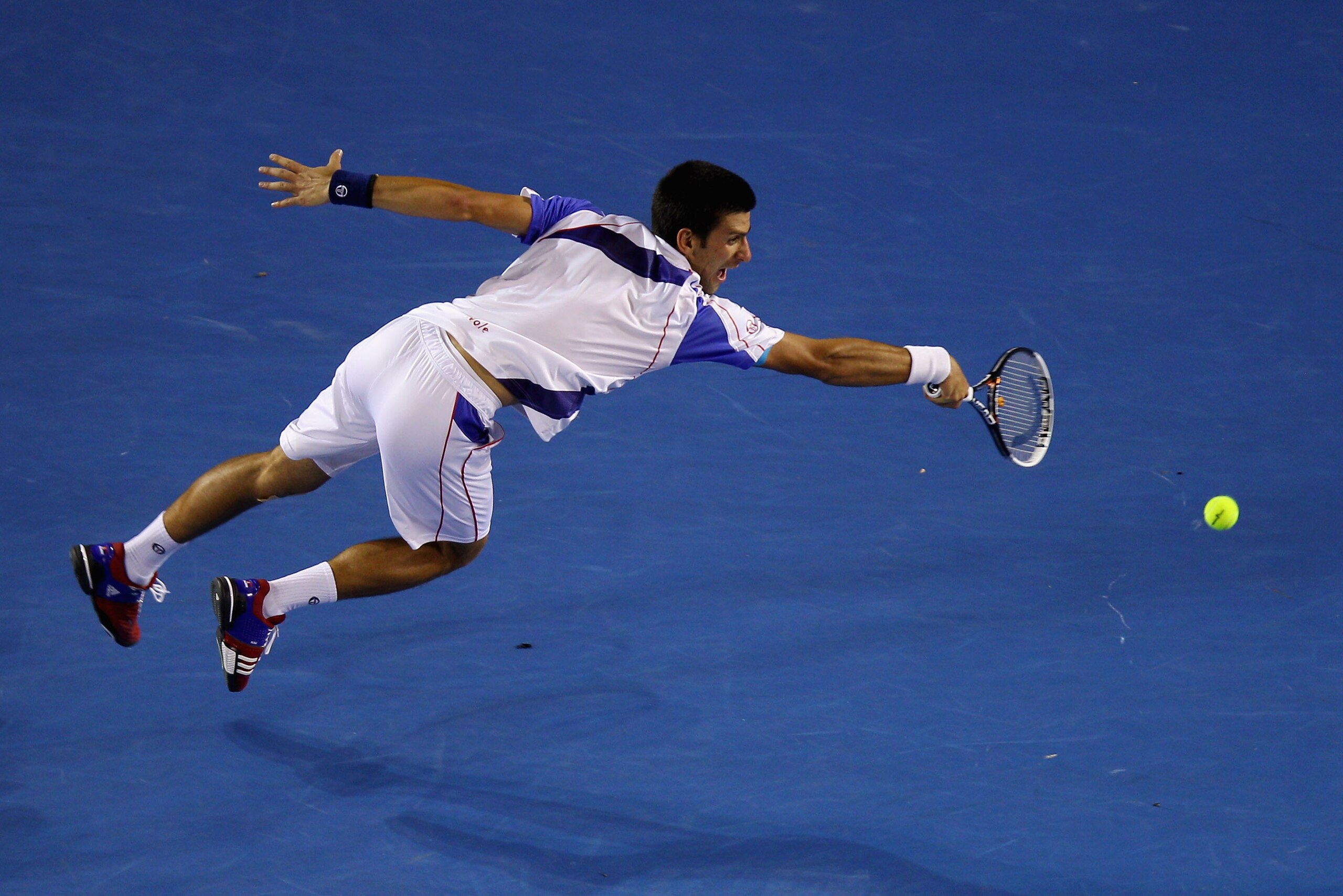 MELBOURNE, AUSTRALIA - JANUARY 30:  Novak Djokovic of Serbia plays a forehand in his men's final match against Andy Murray of Great Britain during day fourteen of the 2011 Australian Open at Melbourne Park on January 30, 2011 in Melbourne, Australia.  (Ph
