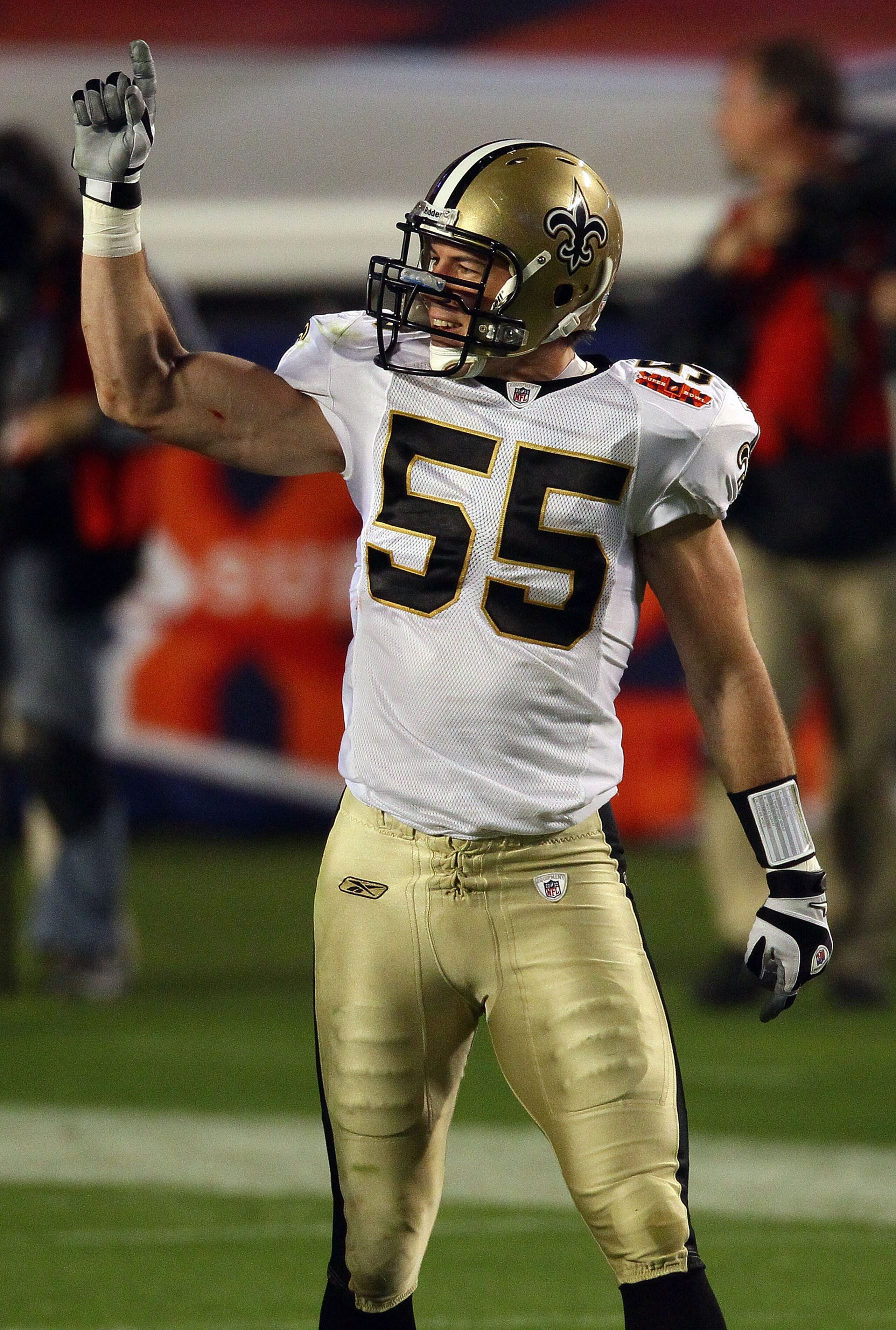 MIAMI GARDENS, FL - FEBRUARY 07: Scott Fujita #55  of the New Orleans Saints celebrates after his team recovers an onside kick to start the second half against the Indianapolis Colts during Super Bowl XLIV on February 7, 2010 at Sun Life Stadium in Miami