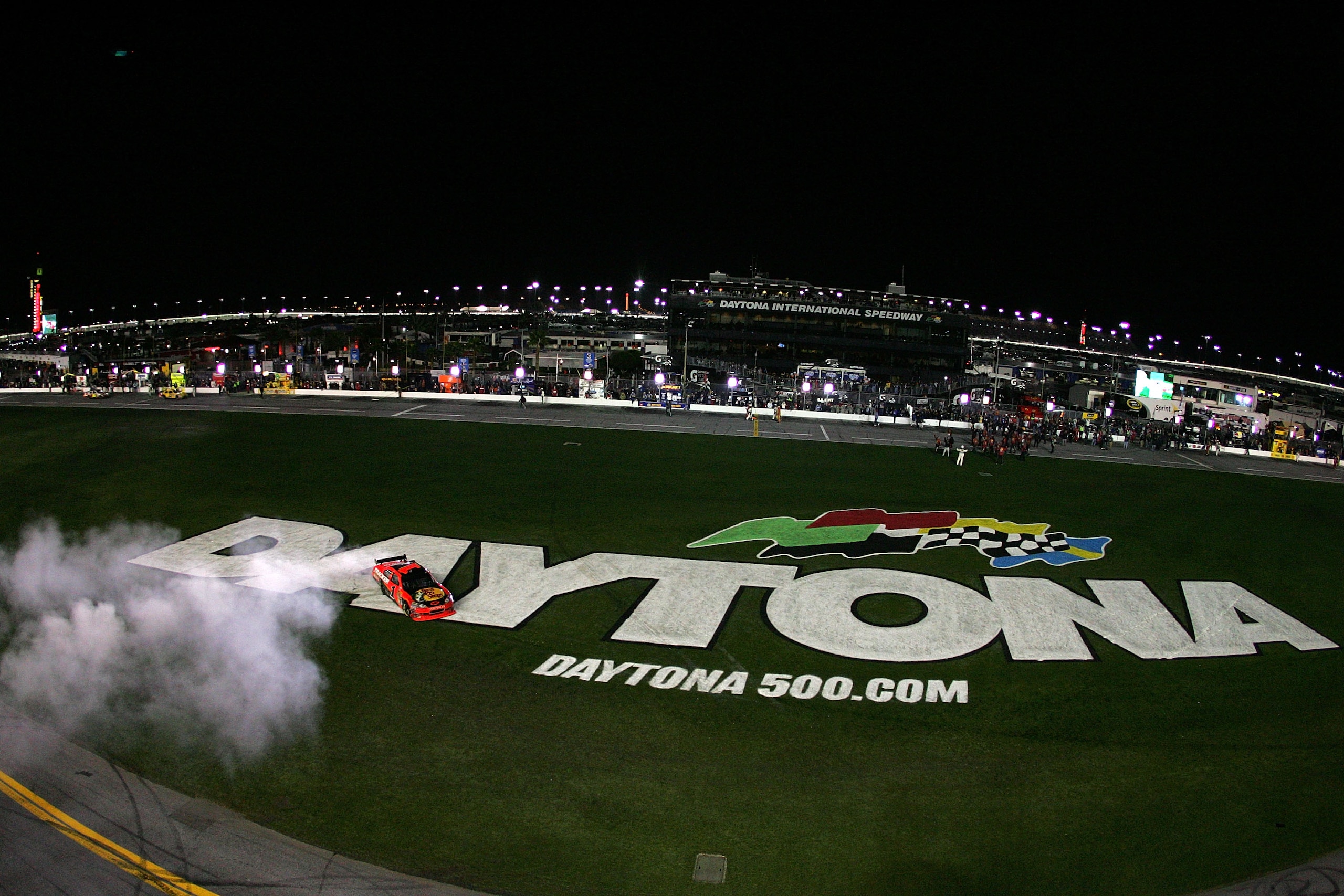 DAYTONA BEACH, FL - FEBRUARY 14:  Jamie McMurray, driver of the #1 Bass Pro Shops/Tracker Boats Chevrolet, celebrates with a burnout after winning the NASCAR Sprint Cup Series Daytona 500 at Daytona International Speedway on February 14, 2010 in Daytona B