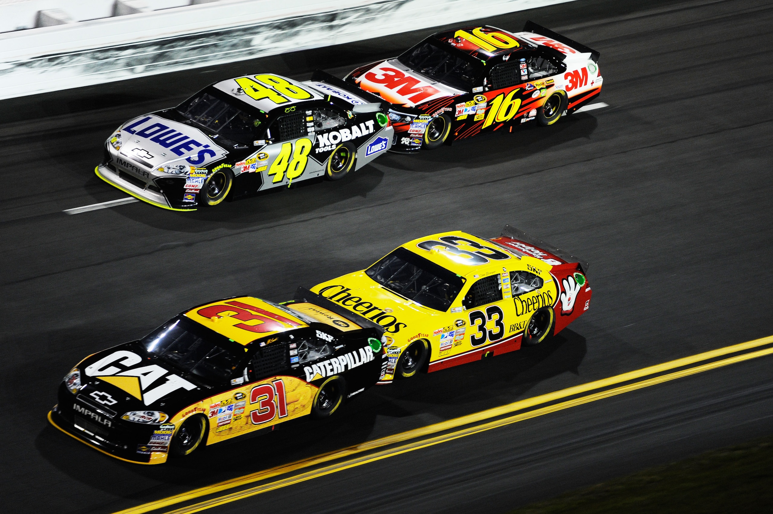 DAYTONA BEACH, FL - FEBRUARY 12: Jeff Burton, driver of the #31 Caterpilliar Chevrolet, Clint Bowyer, driver of the #33 Cheerios Chevrolet, Jimmie Johnson, driver of the #48 Lowe's Chevrolet, and Greg Biffle, driver of the #16 3M Ford, race during the N DAYTONA BEACH, FL - FEBRUARY 12: Jeff Burton, driver of the #31 Caterpilliar Chevrolet, Clint Bowyer, driver of the #33 Cheerios Chevrolet, Jimmie Johnson, driver of the #48 Lowe's Chevrolet, and Greg Biffle, driver of the #16 3M Ford, race during the N