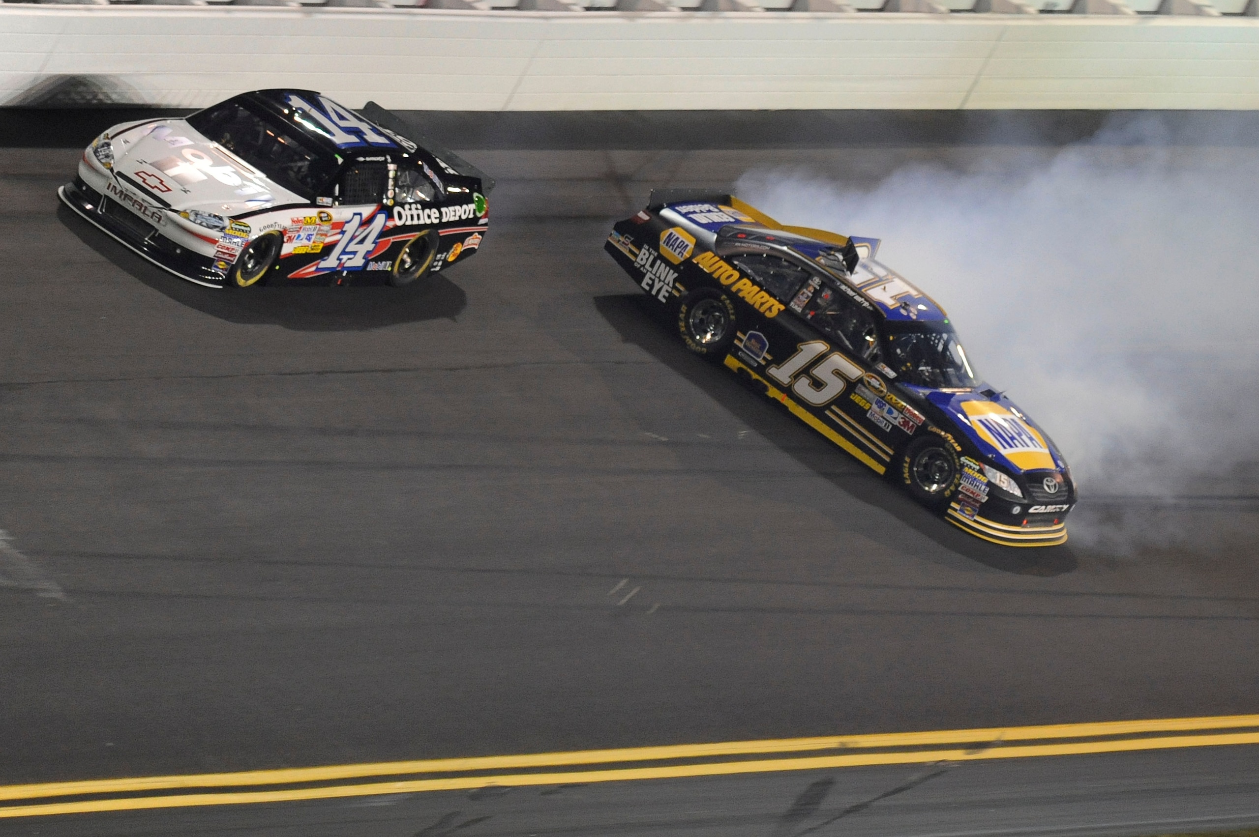 DAYTONA BEACH, FL - FEBRUARY 12: Michael Waltrip, driver of the #15 NAPA Toyota, spins out of control as Tony Stewart, driver of the #14 Mobil 1/Office Depot Chevrolet, passes during the NASCAR Budweiser Shootout at Daytona International Speedway on Febr DAYTONA BEACH, FL - FEBRUARY 12: Michael Waltrip, driver of the #15 NAPA Toyota, spins out of control as Tony Stewart, driver of the #14 Mobil 1/Office Depot Chevrolet, passes during the NASCAR Budweiser Shootout at Daytona International Speedway on Febr