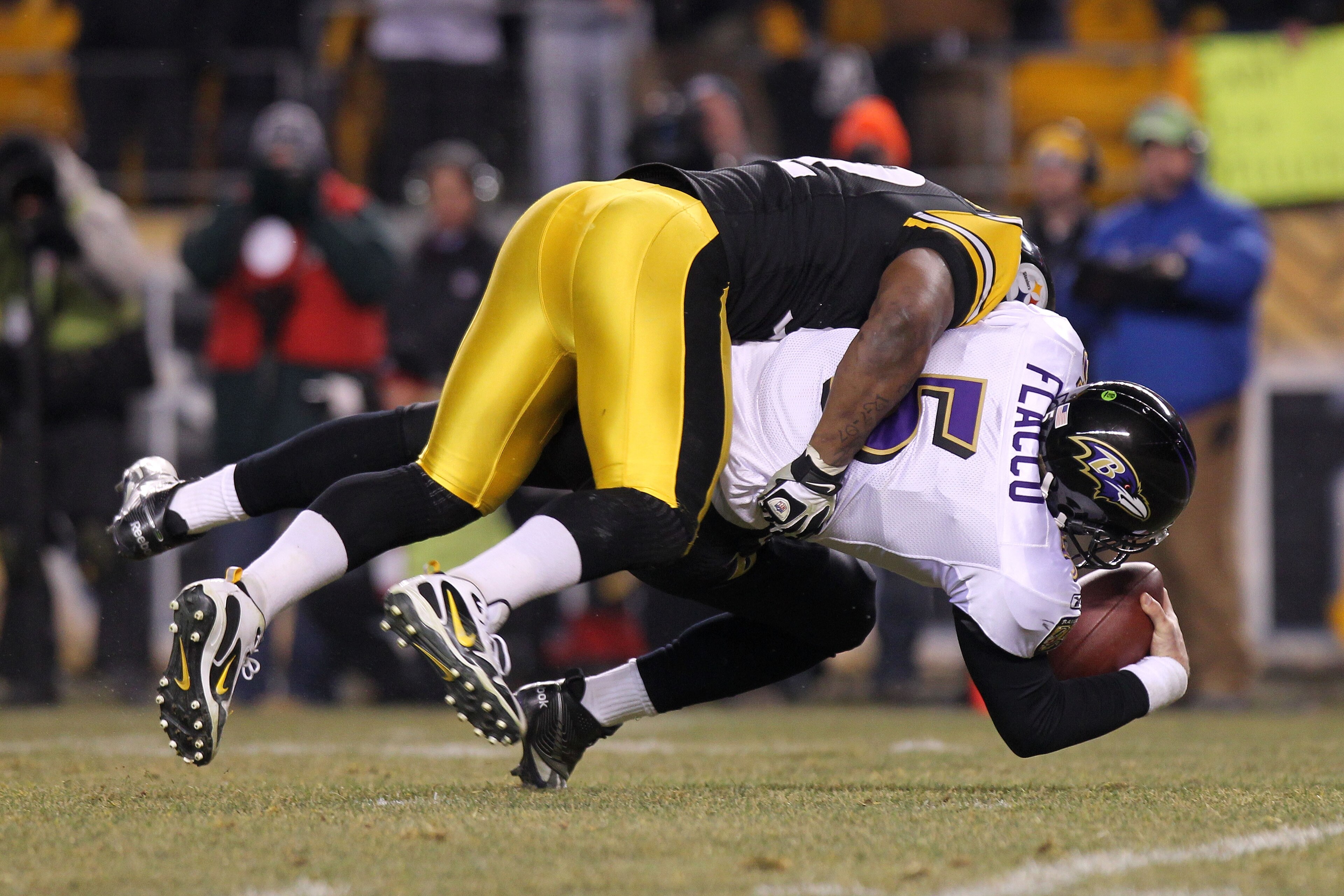 PITTSBURGH, PA - JANUARY 15: Linebacker James Harrison #92 of the Pittsburgh Steelers sacks quarterback Joe Flacco #5 of the Baltimore Ravens during the AFC Divisional Playoff Game at Heinz Field on January 15, 2011 in Pittsburgh, Pennsylvania. (Photo b PITTSBURGH, PA - JANUARY 15: Linebacker James Harrison #92 of the Pittsburgh Steelers sacks quarterback Joe Flacco #5 of the Baltimore Ravens during the AFC Divisional Playoff Game at Heinz Field on January 15, 2011 in Pittsburgh, Pennsylvania. (Photo b