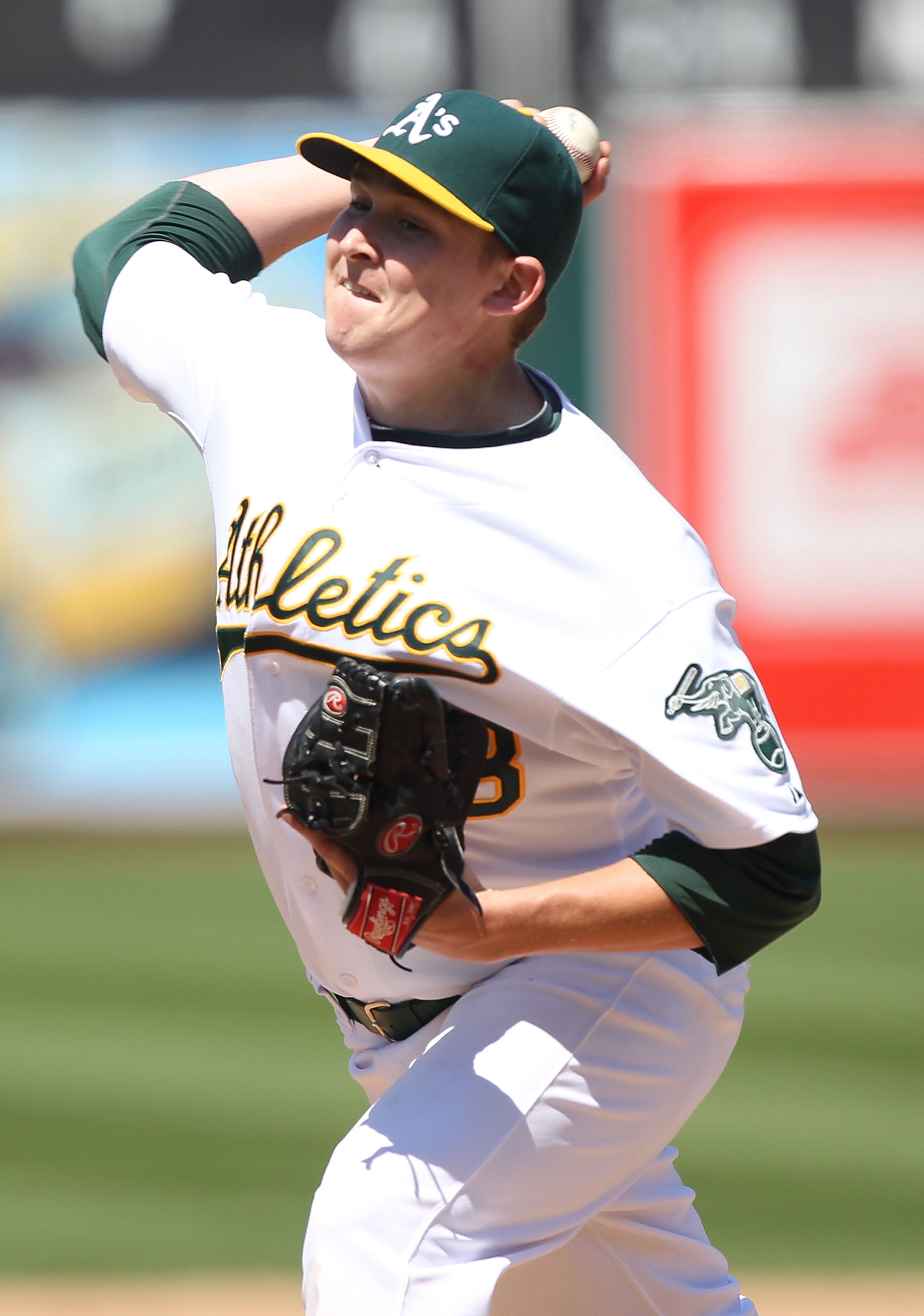 OAKLAND, CA - AUGUST 08:  Trevor Cahill #53 of the Oakland Athletics pitches against the Texas Rangers during an MLB game at the Oakland-Alameda County Coliseum on August 8, 2010 in Oakland, California.  (Photo by Jed Jacobsohn/Getty Images)