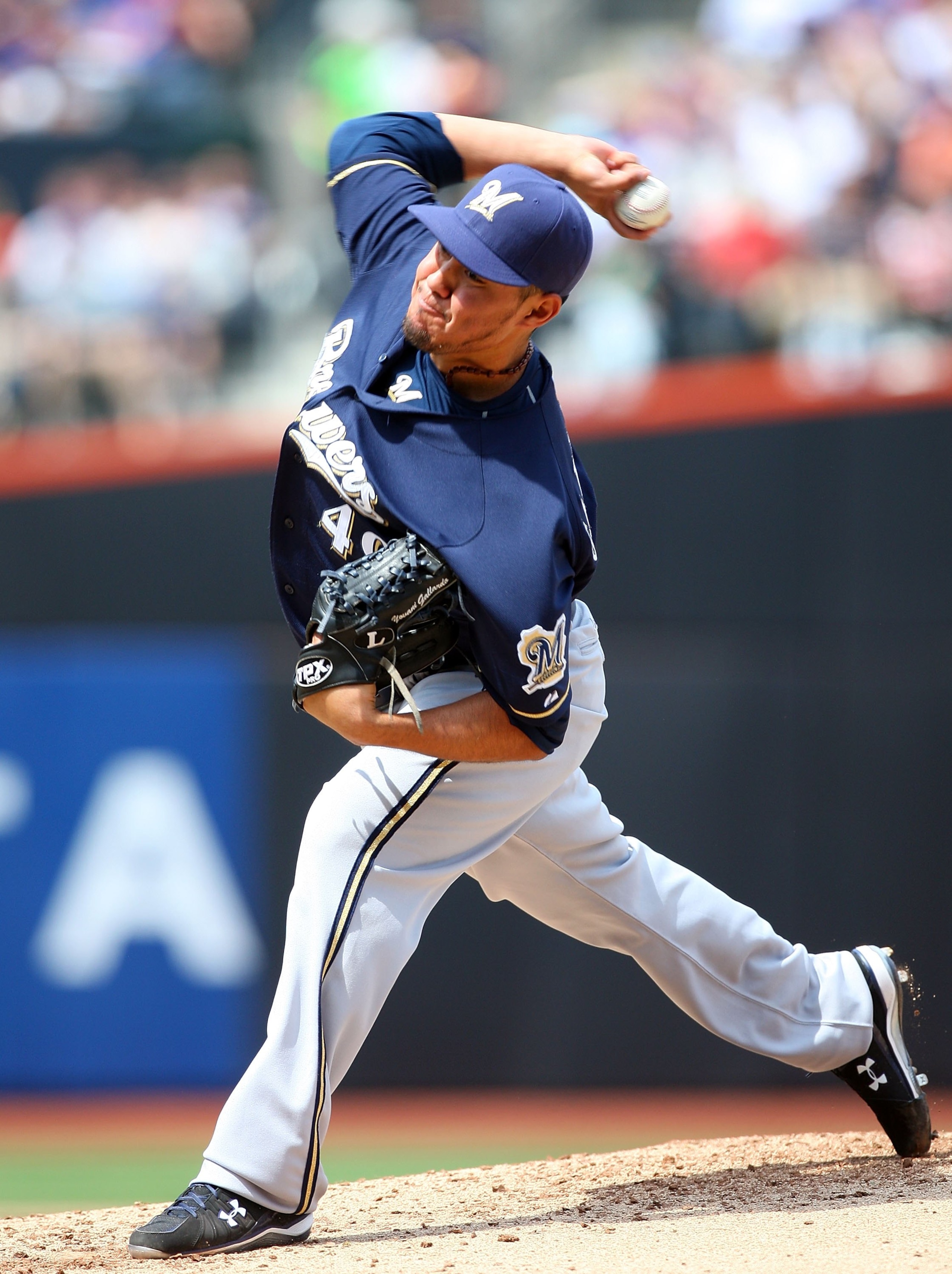 NEW YORK - APRIL 18:  Yovani Gallardo #49 of the Milwaukee Brewers deals a pitch against the New York Mets on April 18, 2009 at Citi Field in the Flushing neighborhood of the Queens borough of New York City.  (Photo by Jim McIsaac/Getty Images)