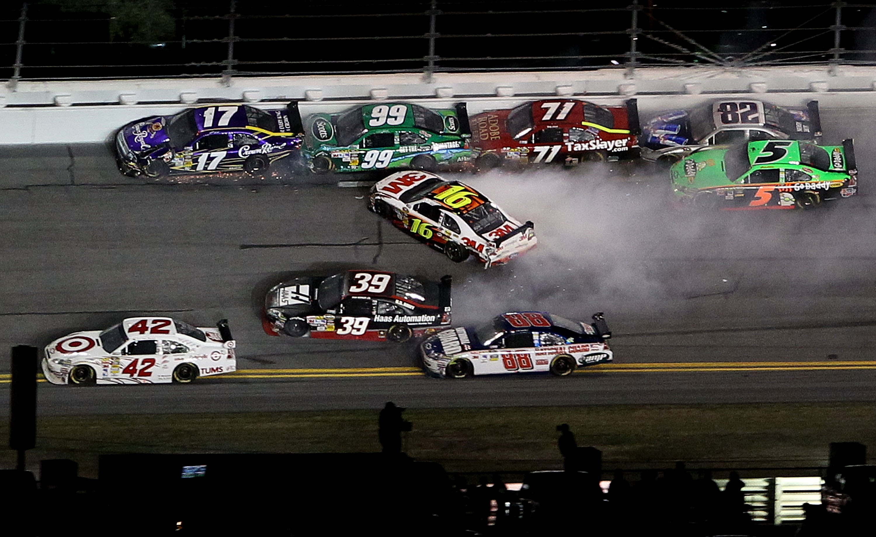 DAYTONA BEACH, FL - FEBRUARY 06: Greg Biffle, driver of the #16 3M Ford loses control in a multi car incident during the Budweiser Shootout at Daytona International Speedway on February 6, 2010 in Daytona Beach, Florida.  (Photo by Nick Laham/Getty Images