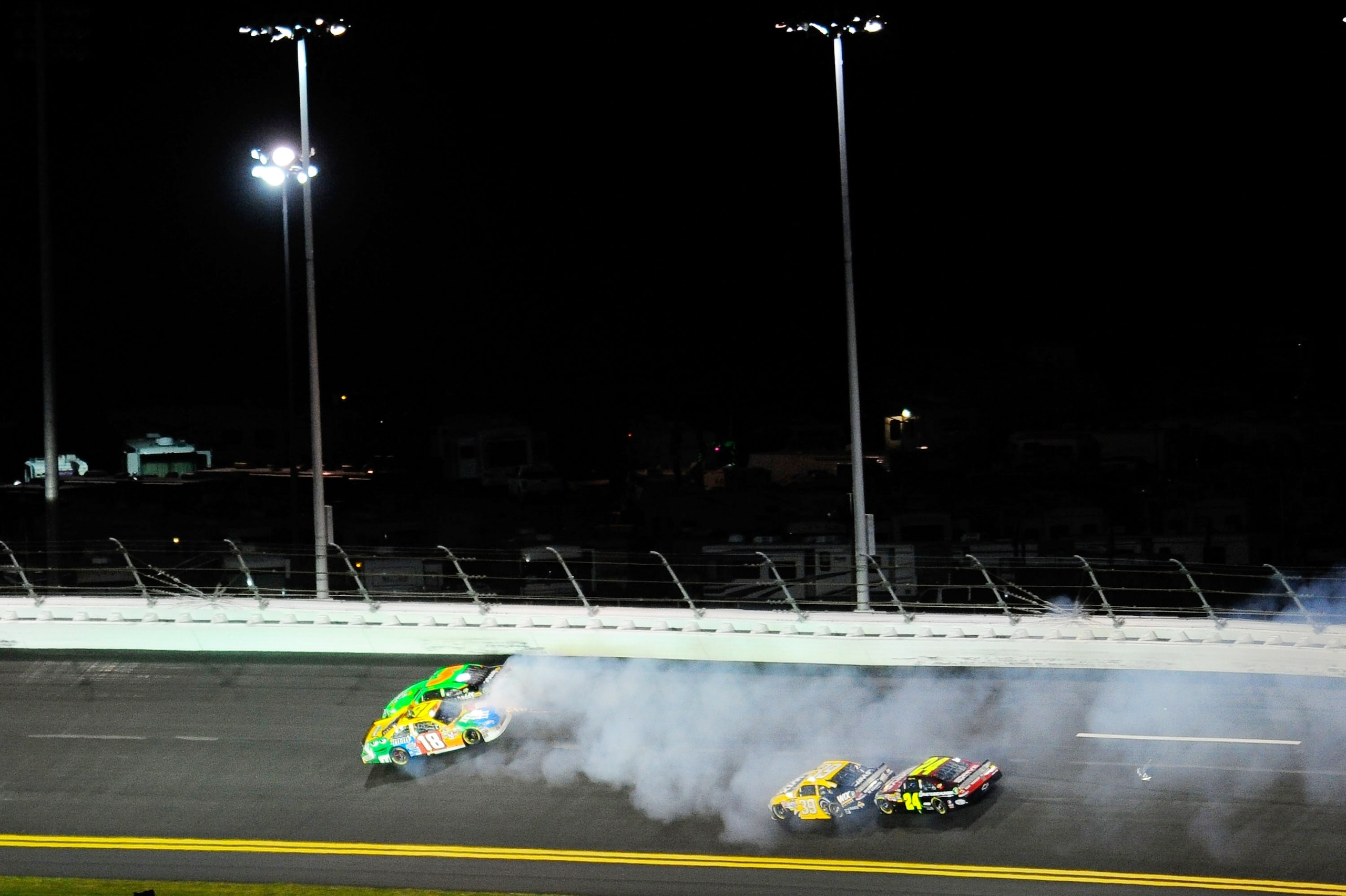 DAYTONA BEACH, FL - FEBRUARY 12: Kyle Busch, driver of the #18 M&M's Toyota, and Mark Martin, driver of the #5 GoDaddy.com Chevrolet, get tangled up in turn two during the NASCAR Budweiser Shootout at Daytona International Speedway on February 12, 2011 i DAYTONA BEACH, FL - FEBRUARY 12: Kyle Busch, driver of the #18 M&M's Toyota, and Mark Martin, driver of the #5 GoDaddy.com Chevrolet, get tangled up in turn two during the NASCAR Budweiser Shootout at Daytona International Speedway on February 12, 2011 i